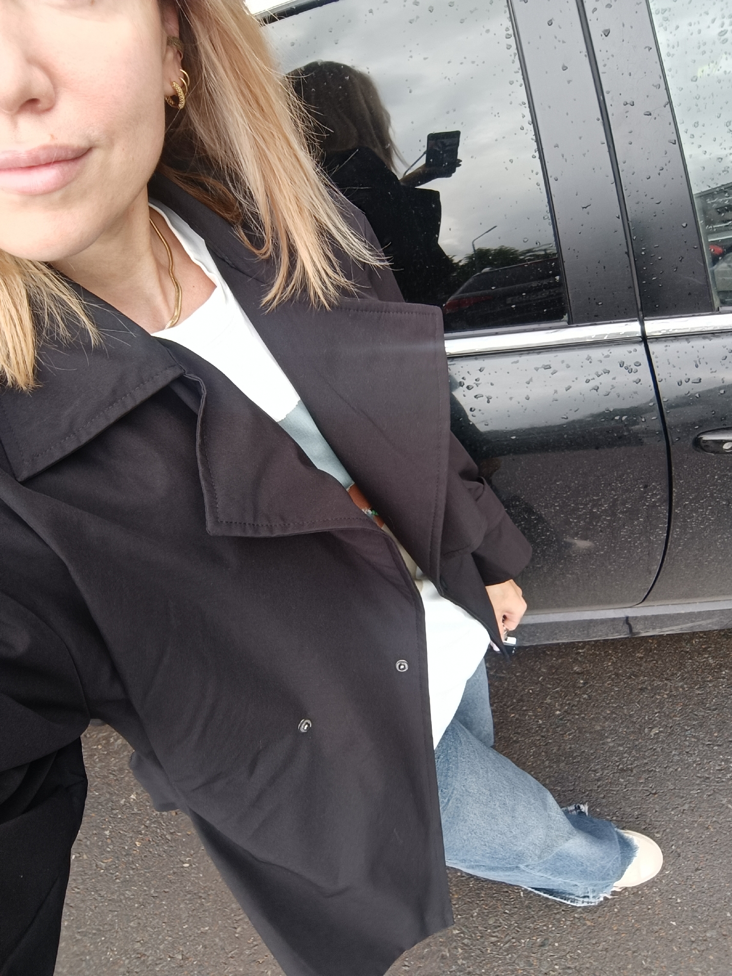 Woman takes selfie by car in Naberezhnye Chelny