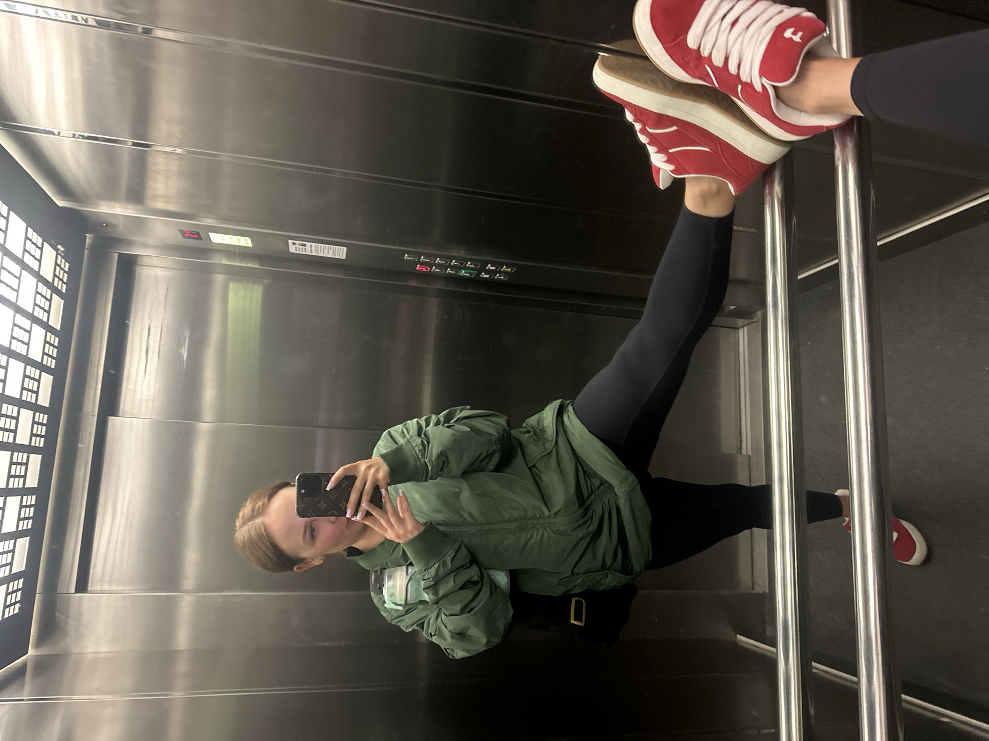 Cat on stone wall and elevator selfie in Budva