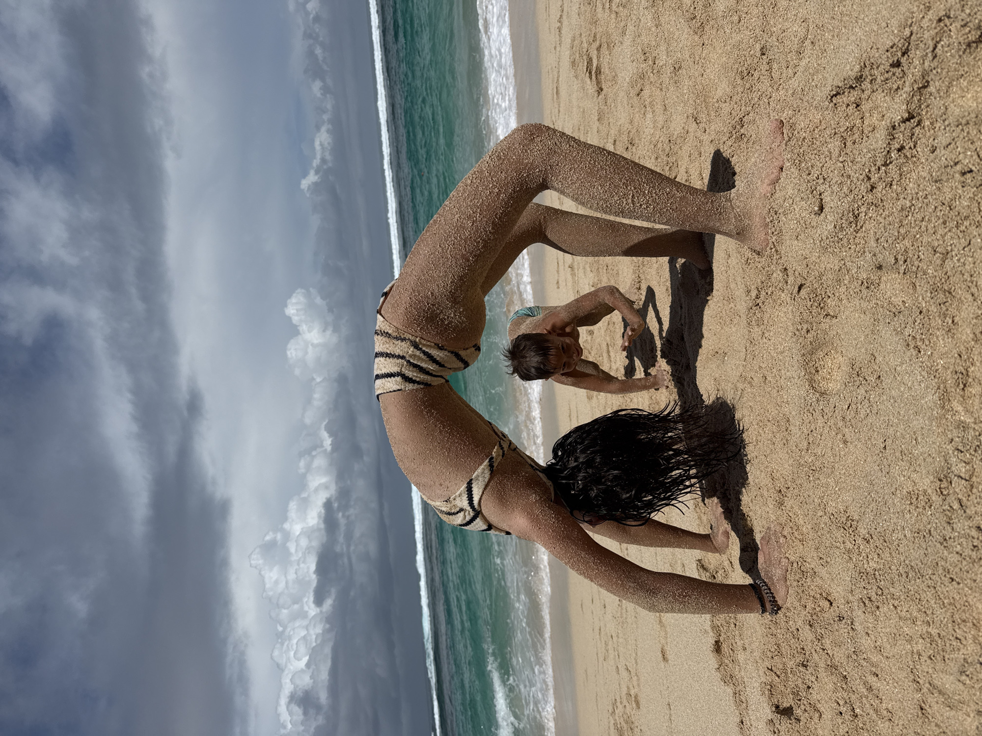 Beachgoers enjoy early morning activities in Kuta Selatan, Indonesia