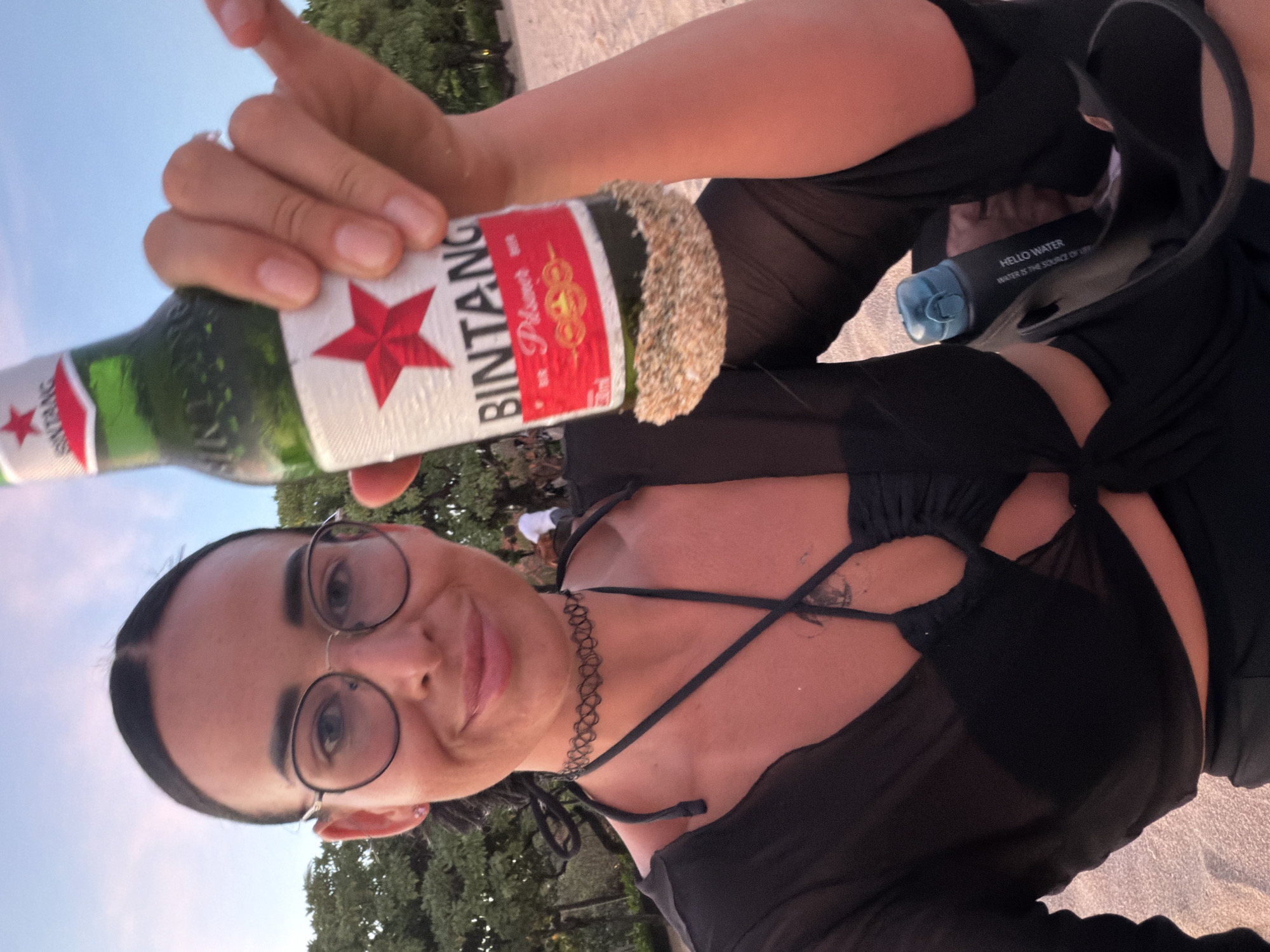 Beach picnic with beer and pizza in Bali