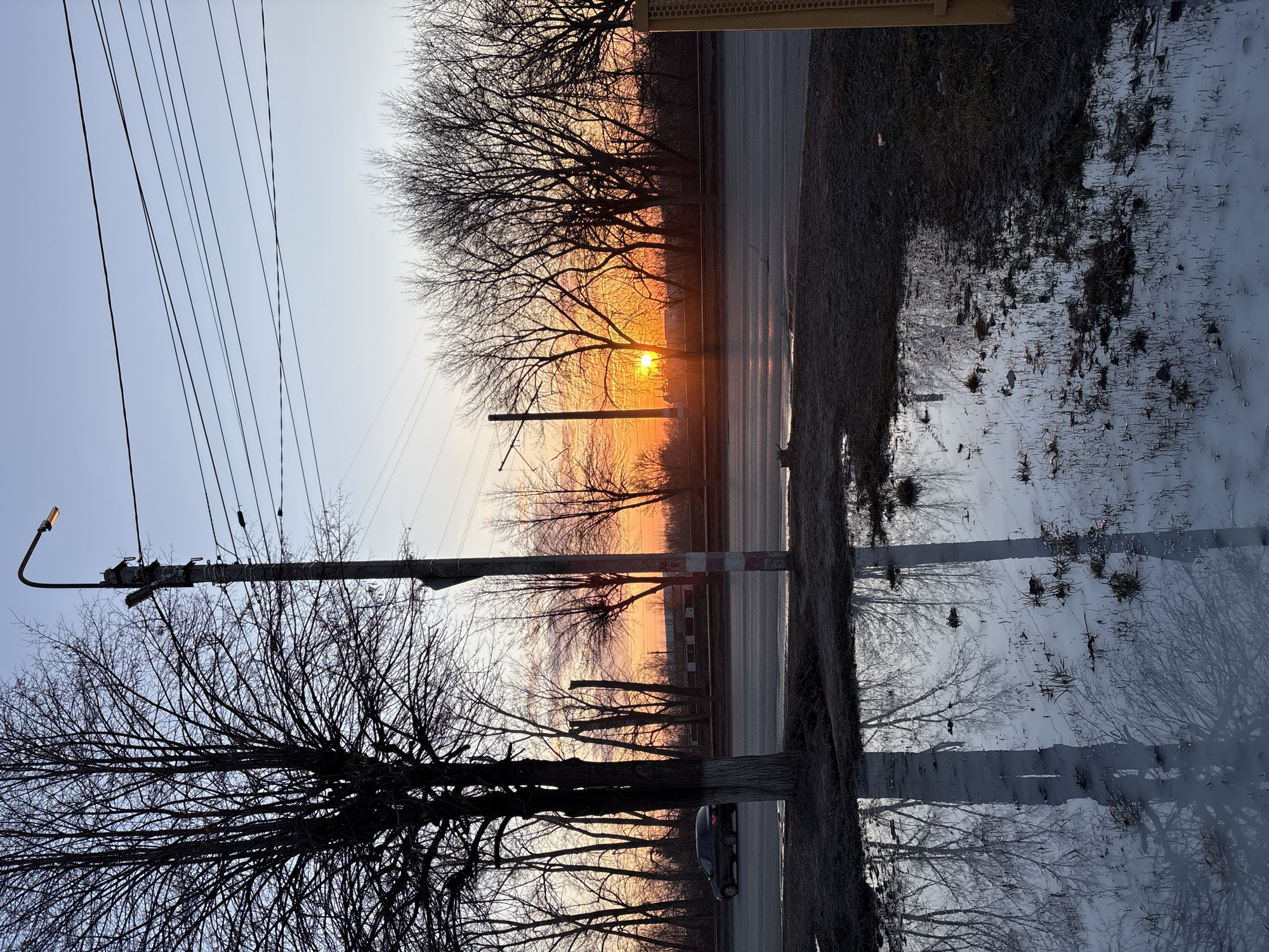 Woman takes sunset selfies on Ulyanovsk street