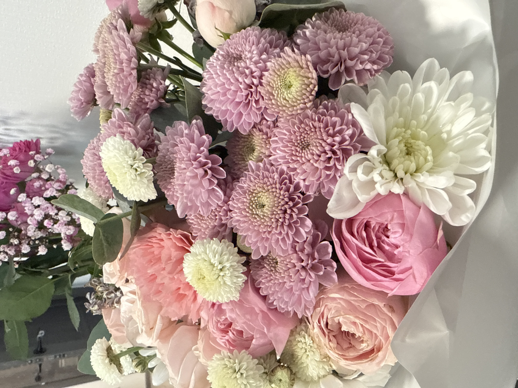 Woman receives flowers, cooks breakfast in Saint Petersburg morning