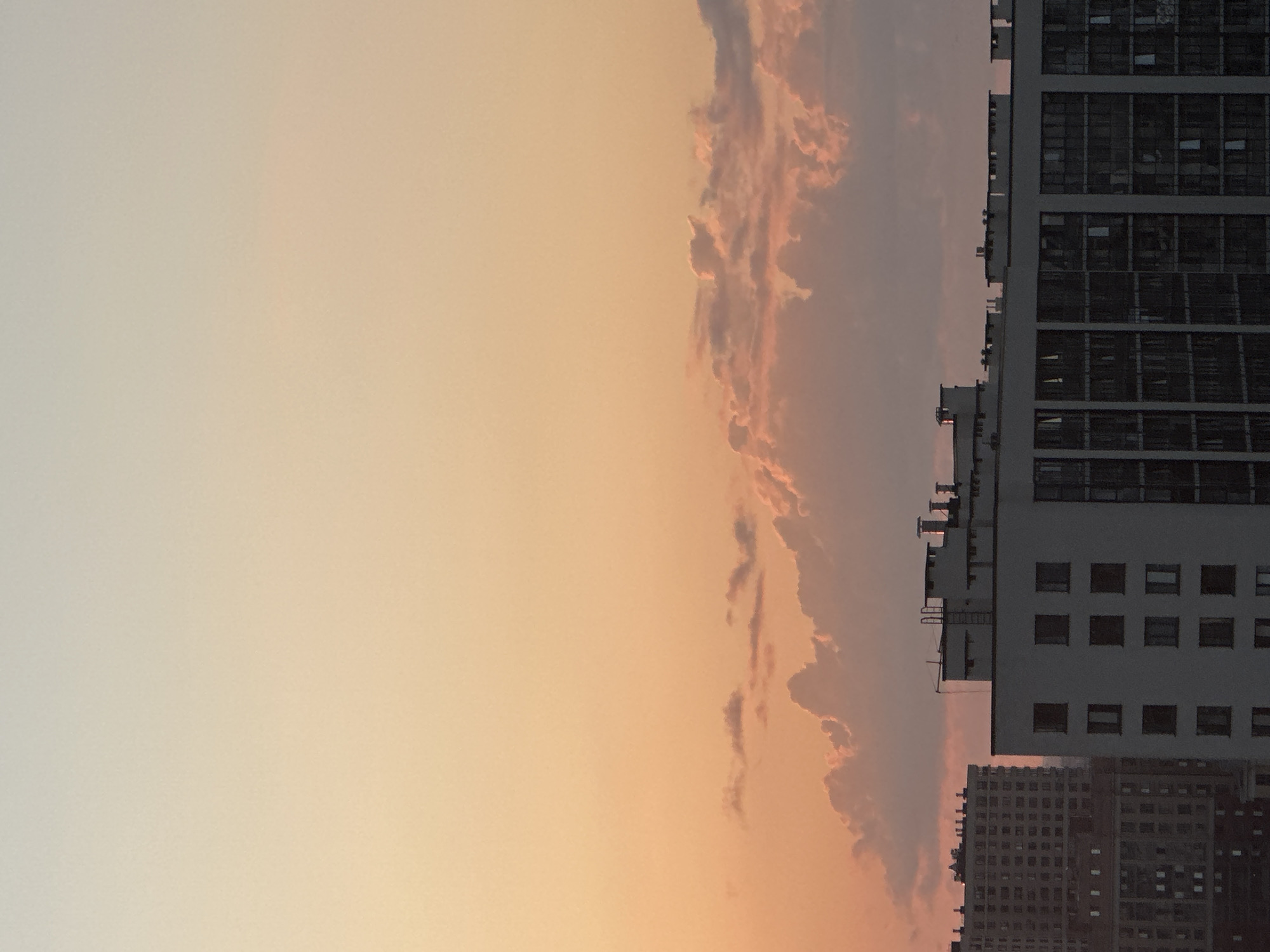 Warm sunset gradient over a Russian cityscape