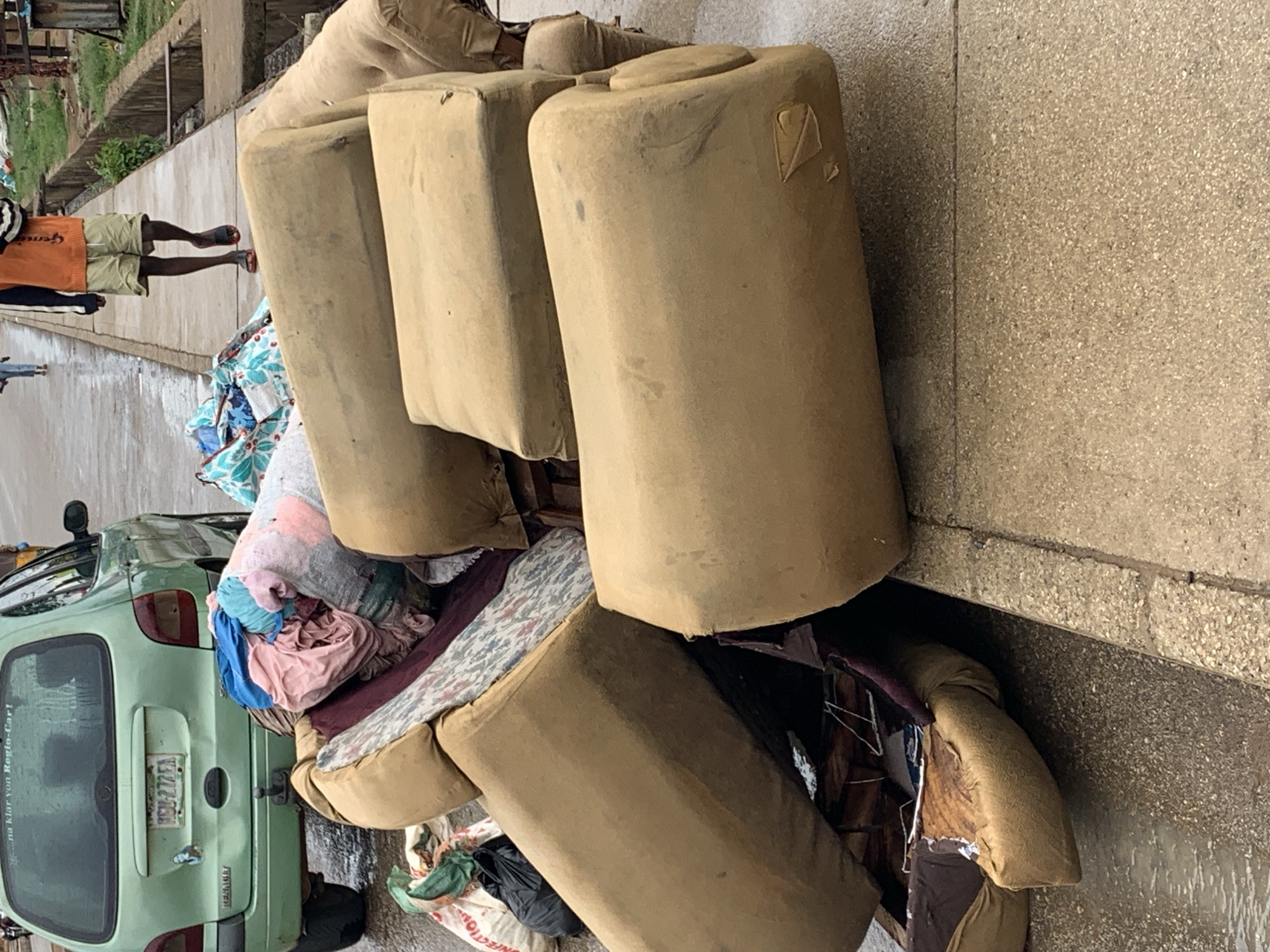 Ordinary street life documented across Jos, Nigeria during rainy morning