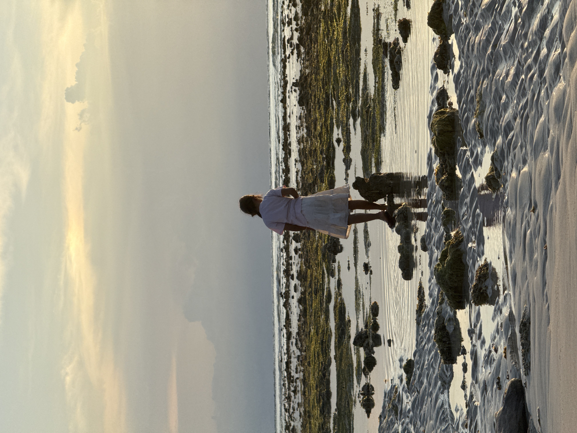 Woman observed on Indonesian beach during low tide morning hours