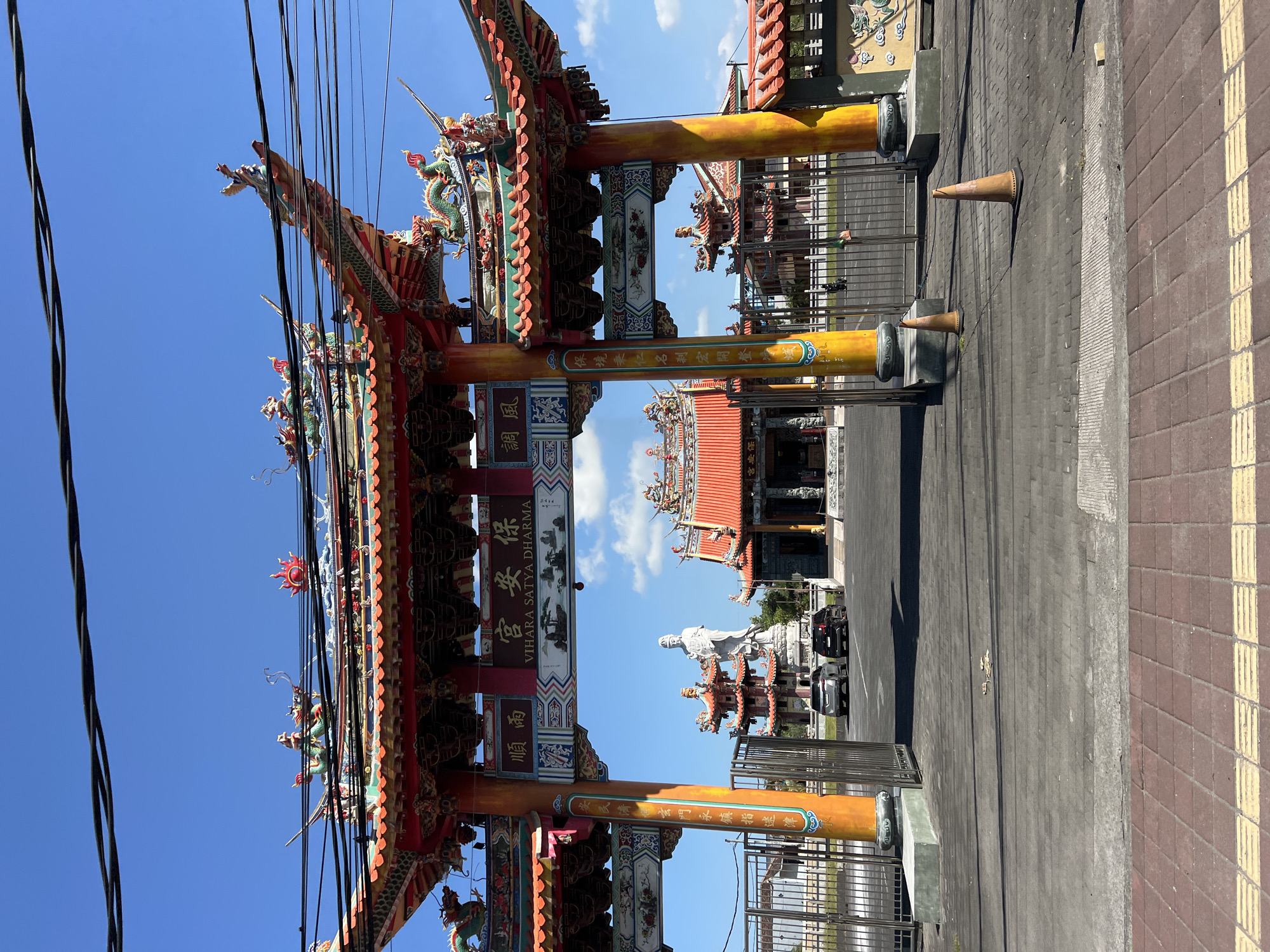 Ornate dragon archway marks Denpasar's Vihara Satya Dharma temple entrance
