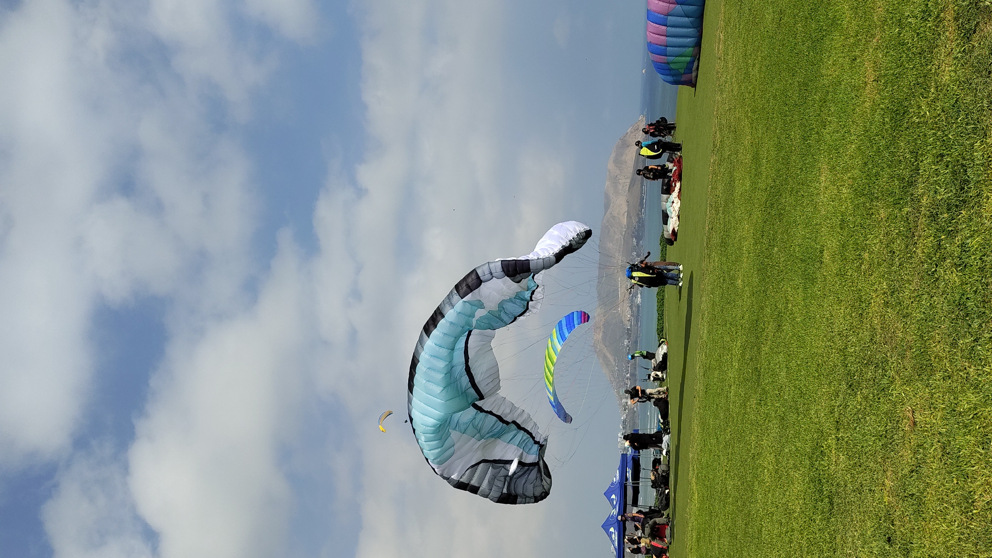 Paragliders soaring off the Miraflores cliffs over the Pacific