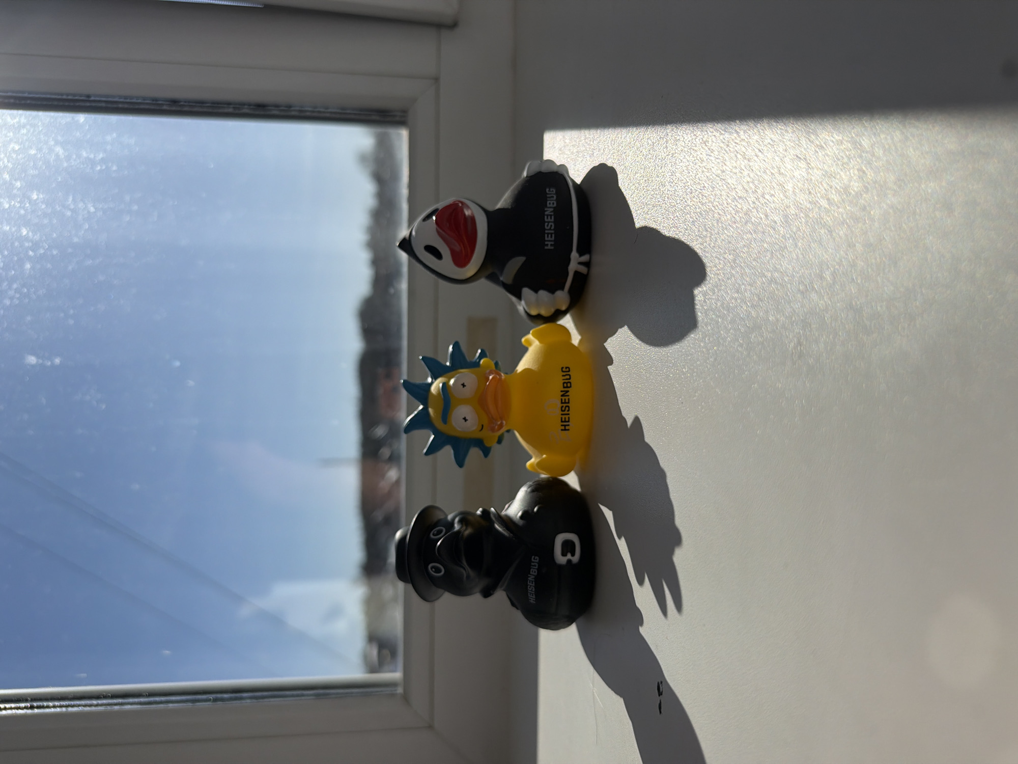 Collectible duck figures displayed on windowsill in Chaikovsky, Russia