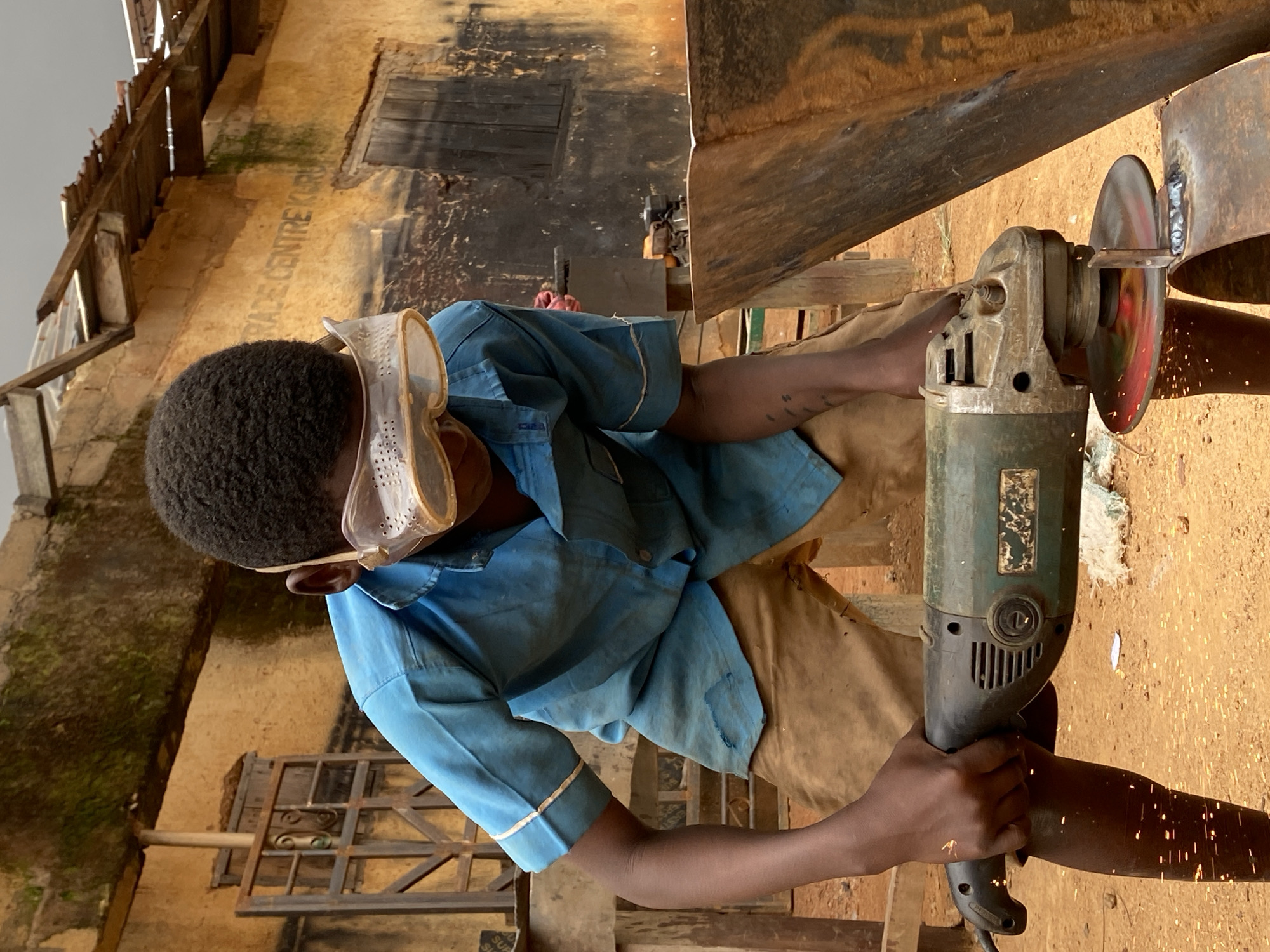 Young metalworkers and children captured in Kuru Dungus, Nigeria