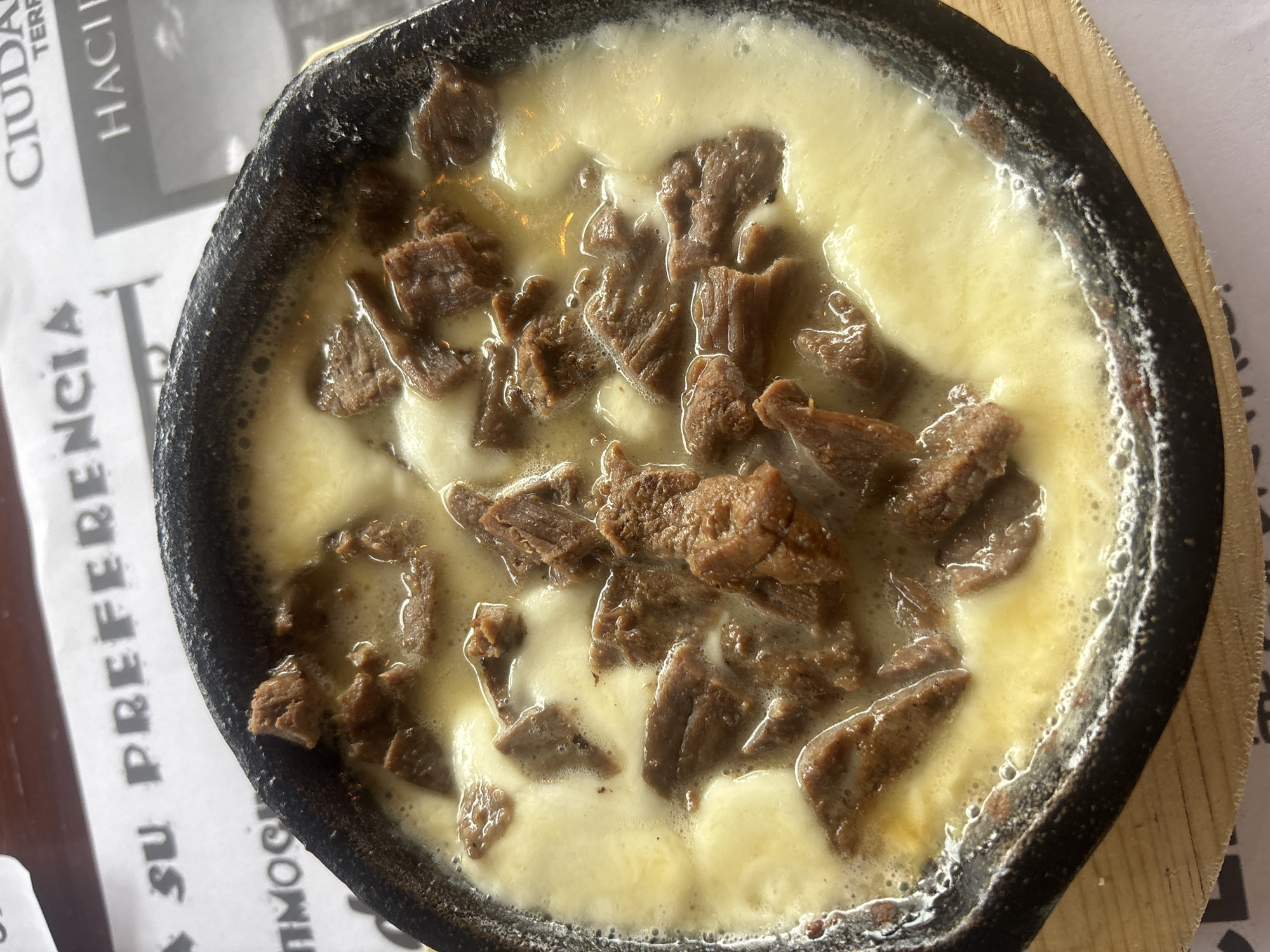 Hot beef cheese dish served in Puebla skillet