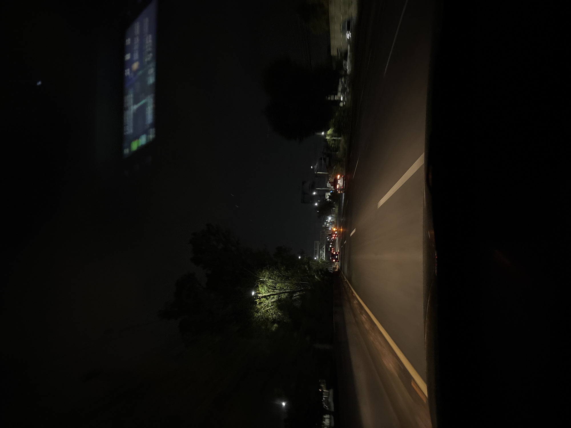 Nighttime drive captured on illuminated Puebla city streets