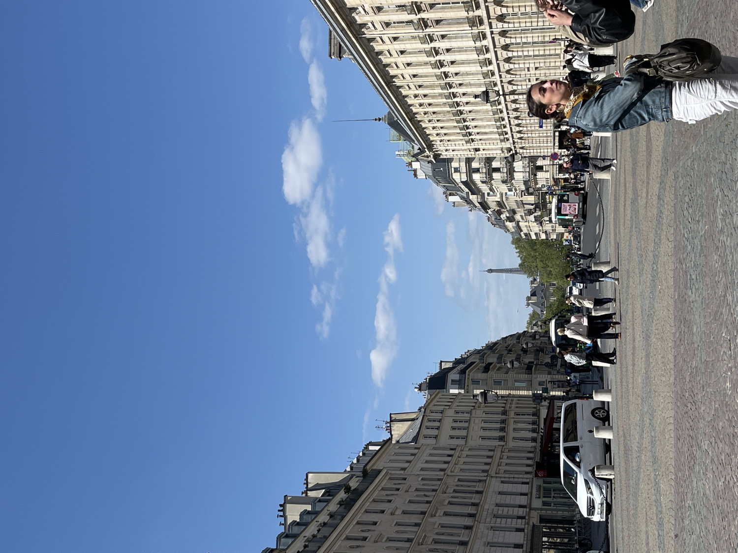 Pedestrians spotted on Paris street with Eiffel Tower backdrop