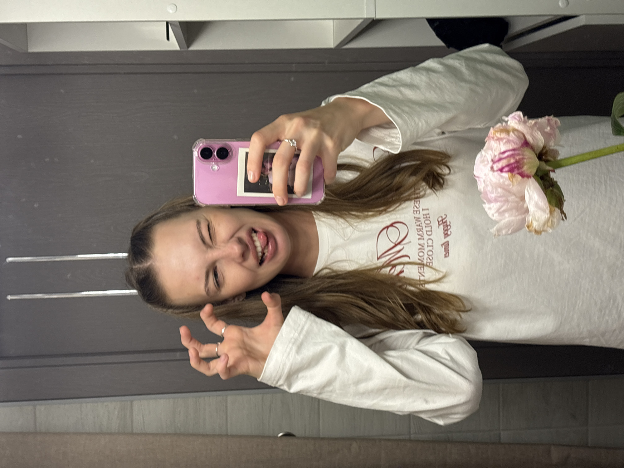 Mirror selfies in a Perm bathroom, pink phone and peonies