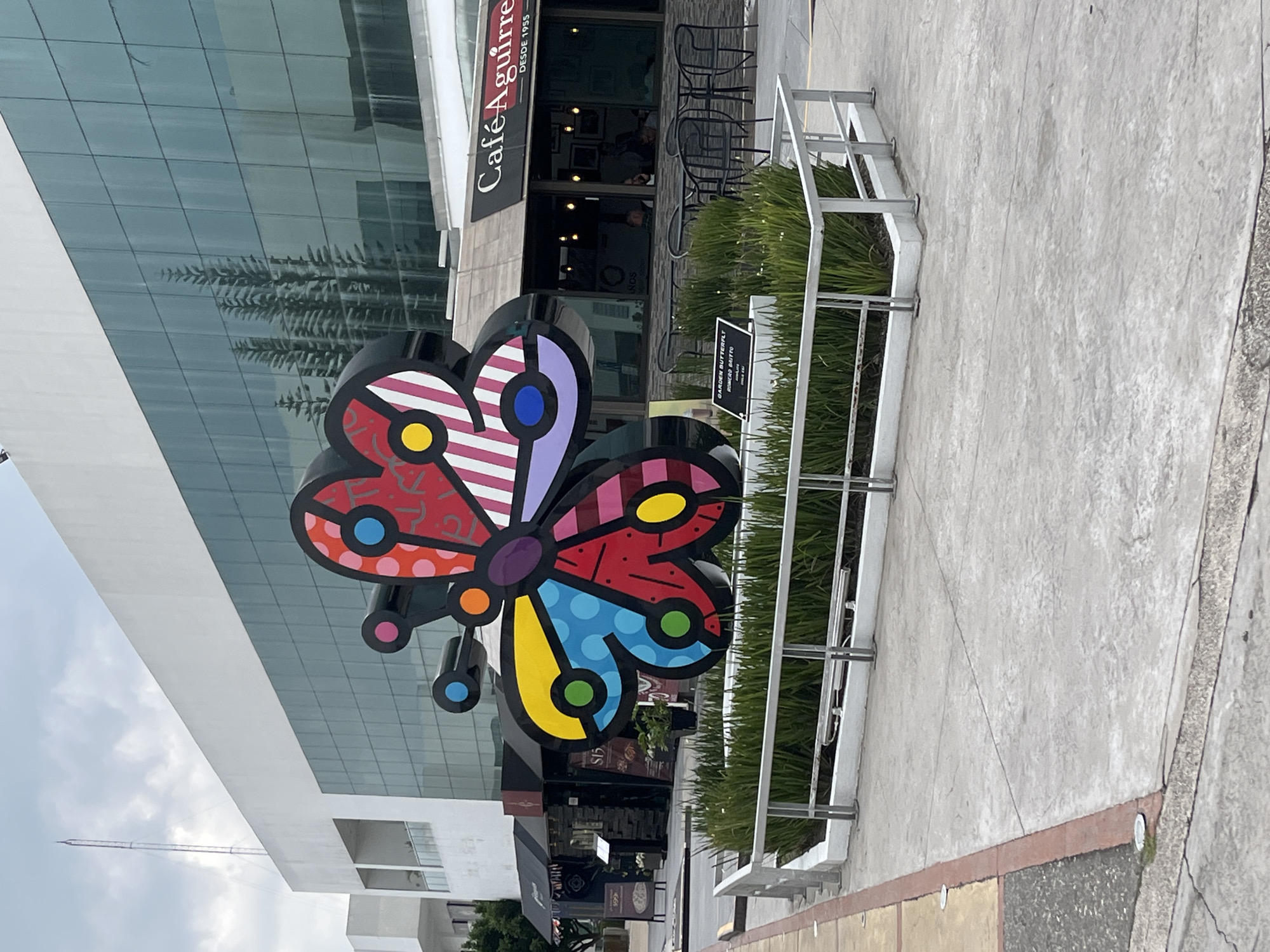 Bold public art: butterfly sculpture and disco ball basketball hoop