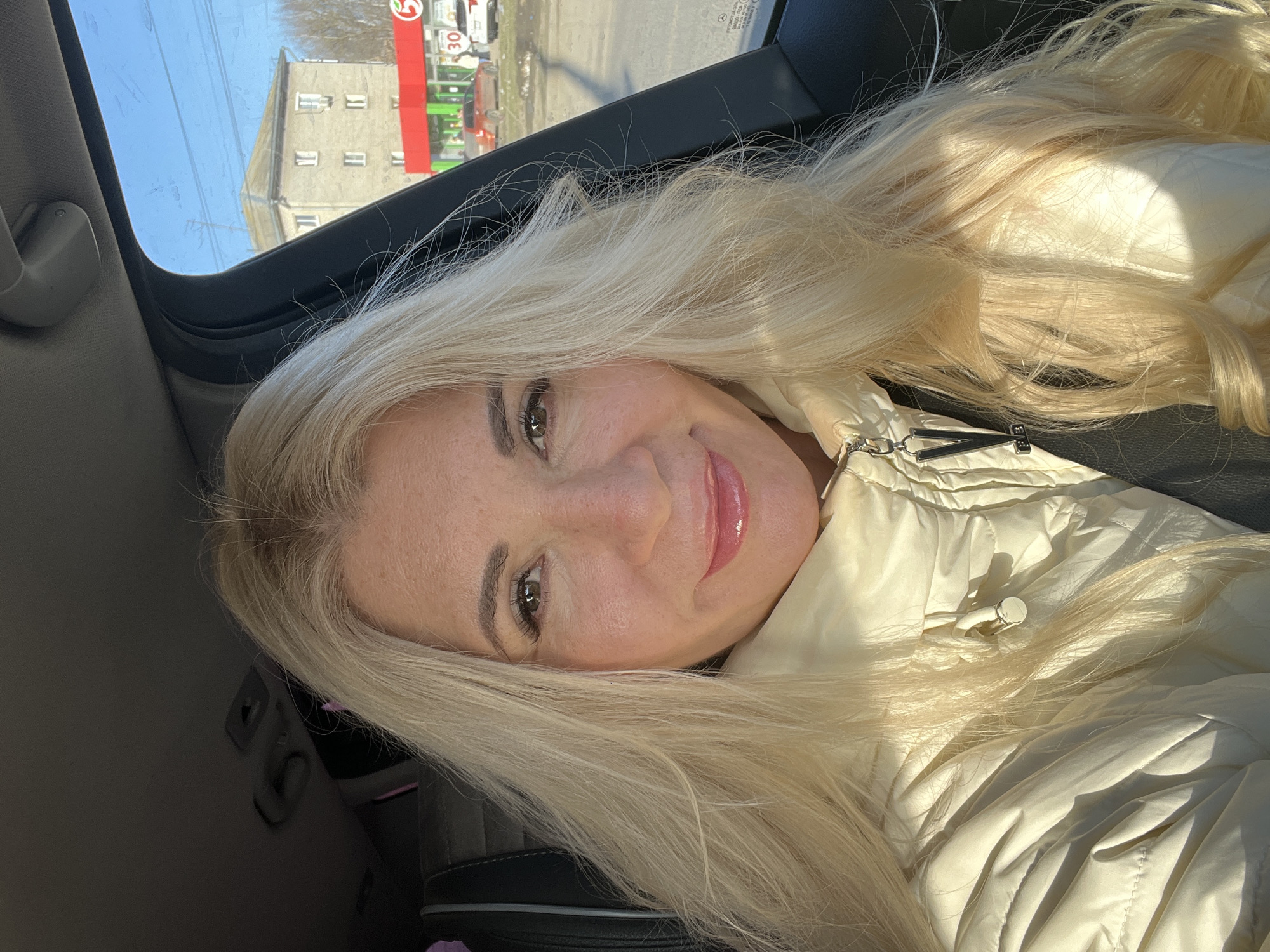 Woman smiling in car in Nizhny Novgorod