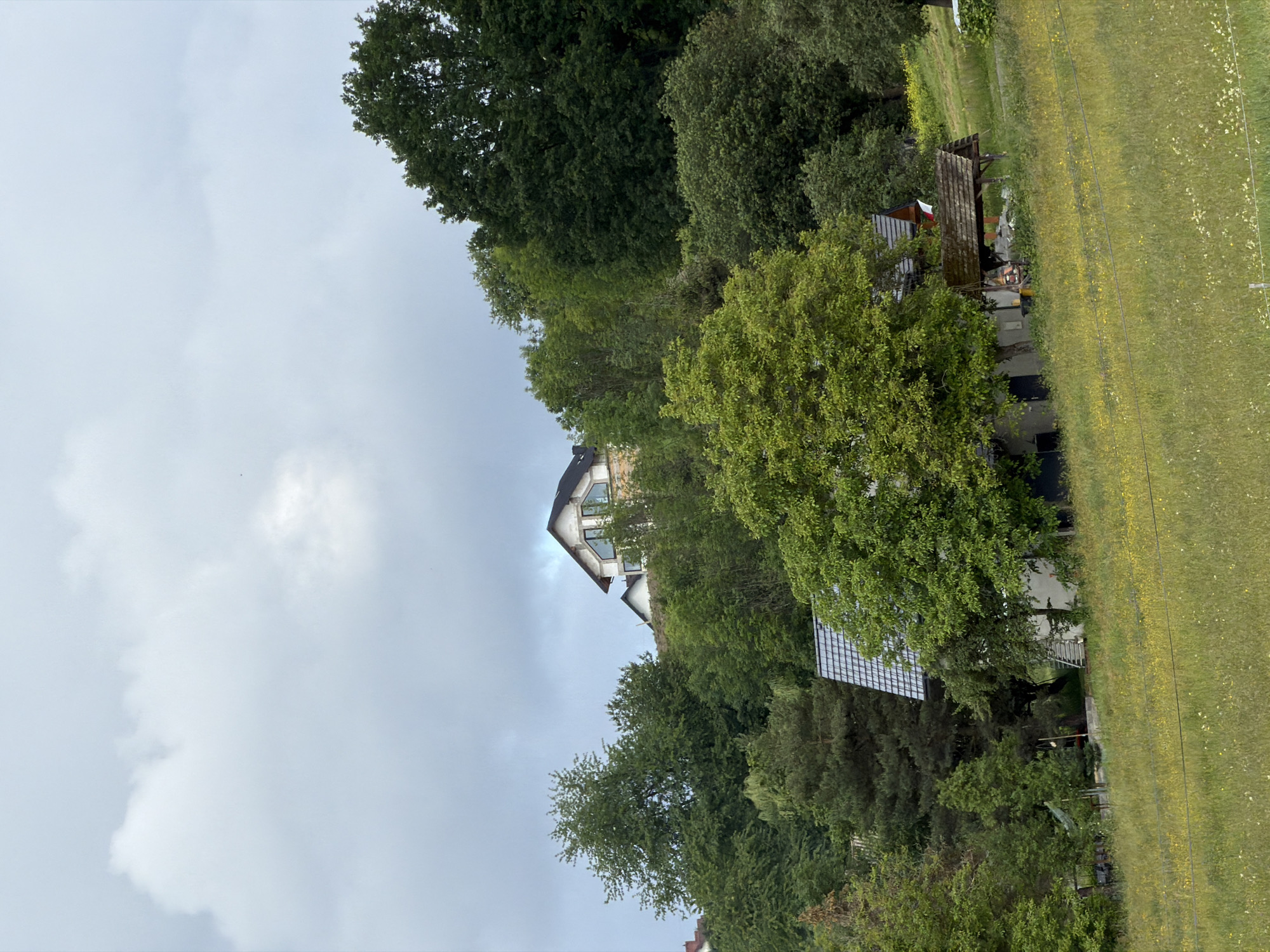 Construction work proceeds under stormy skies in rural Poland