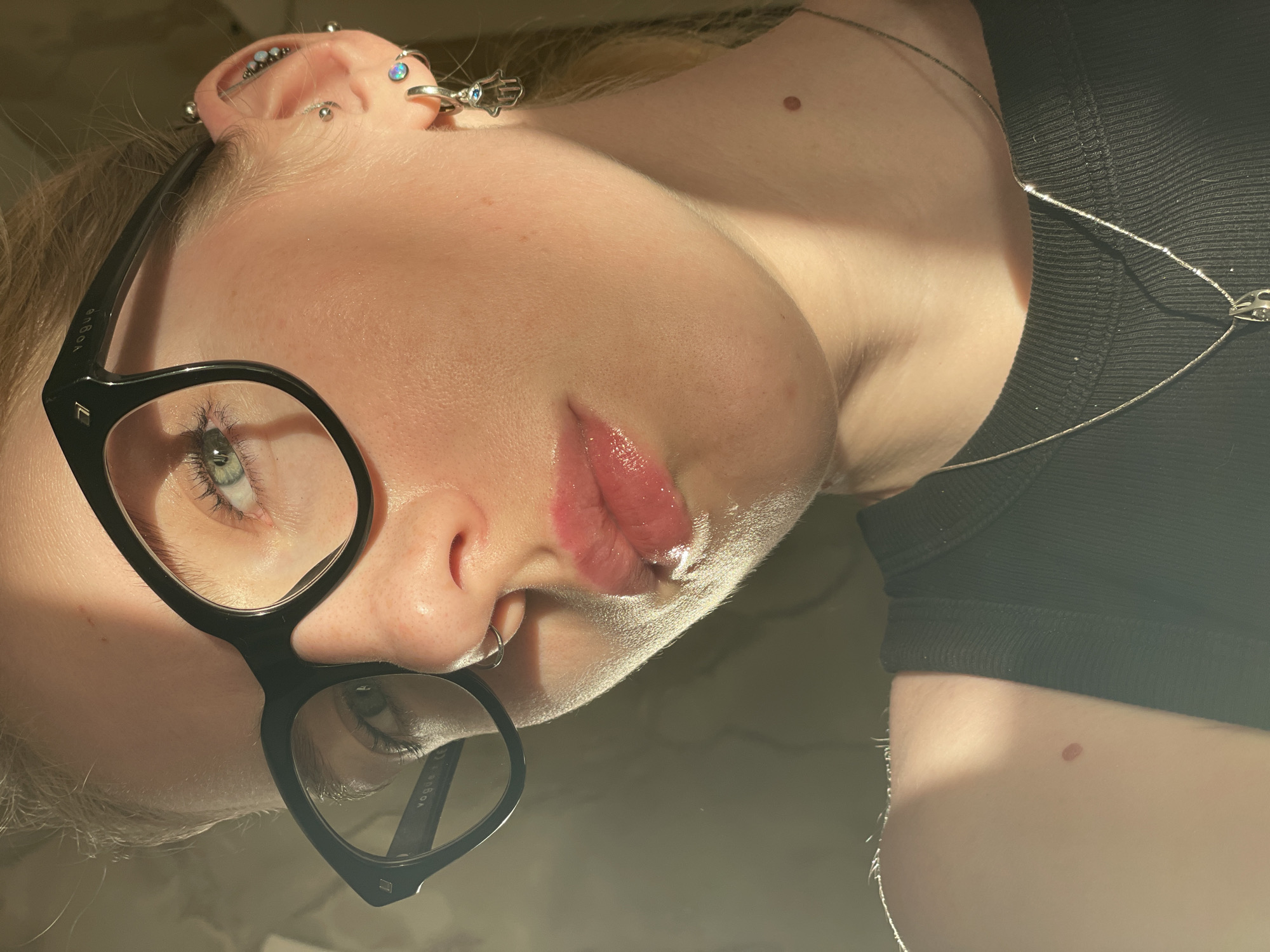 Person and cat photographed together in Izhevsk apartment setting
