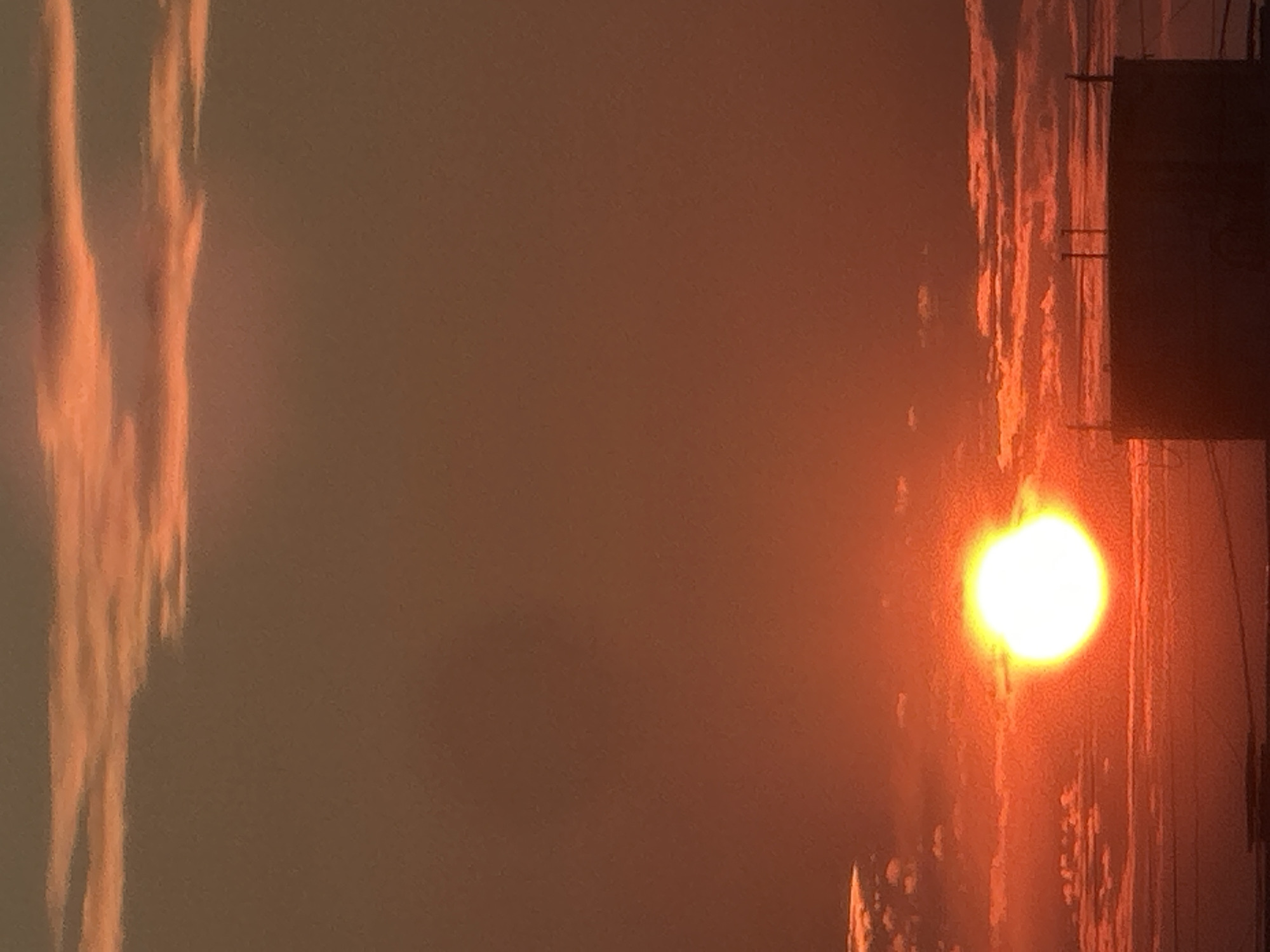Warm sunrise light breaks over Bakhchysarai rooftops