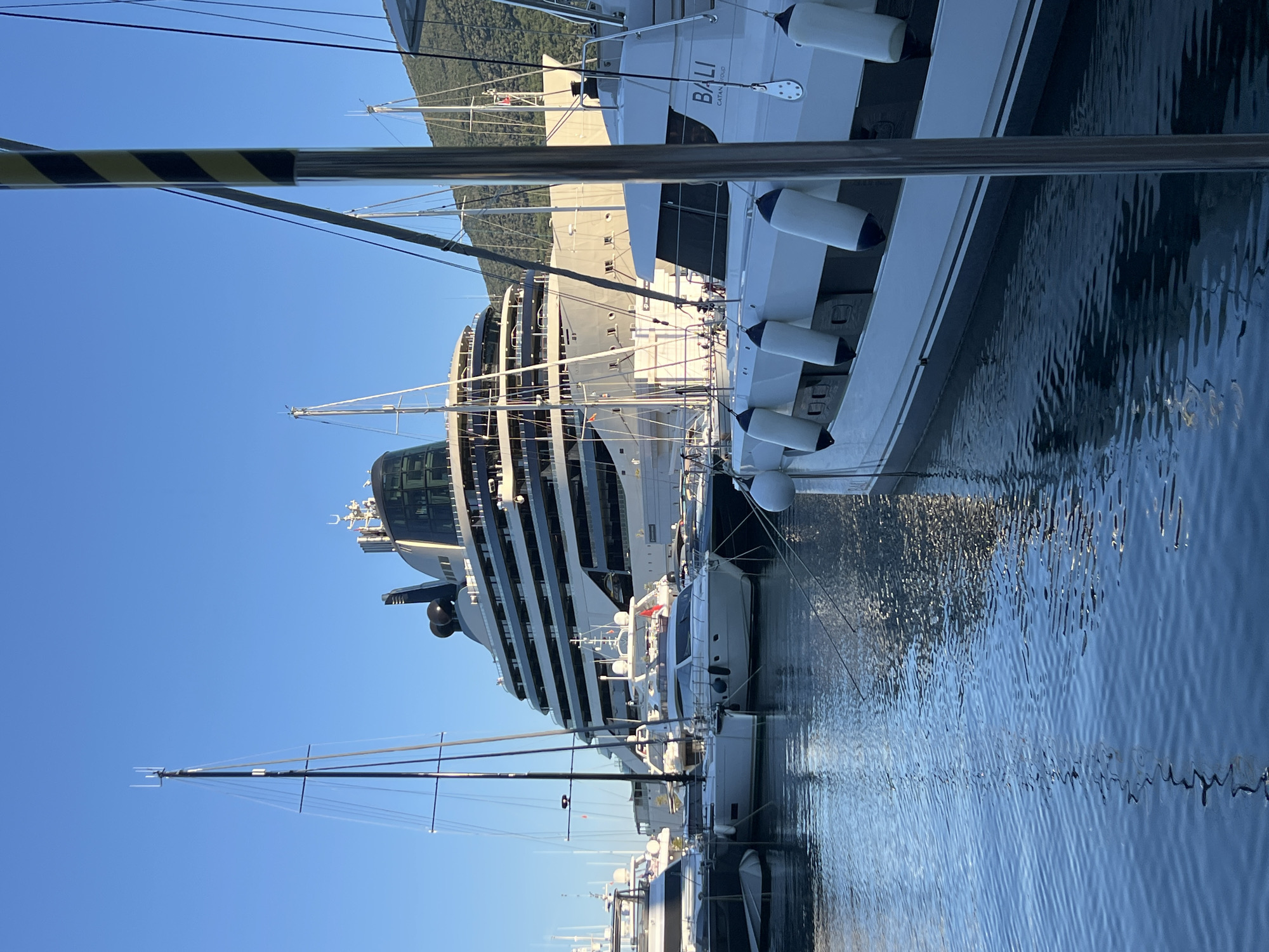 Luxury yachts dock in Montenegro marinas amid casual summer activity