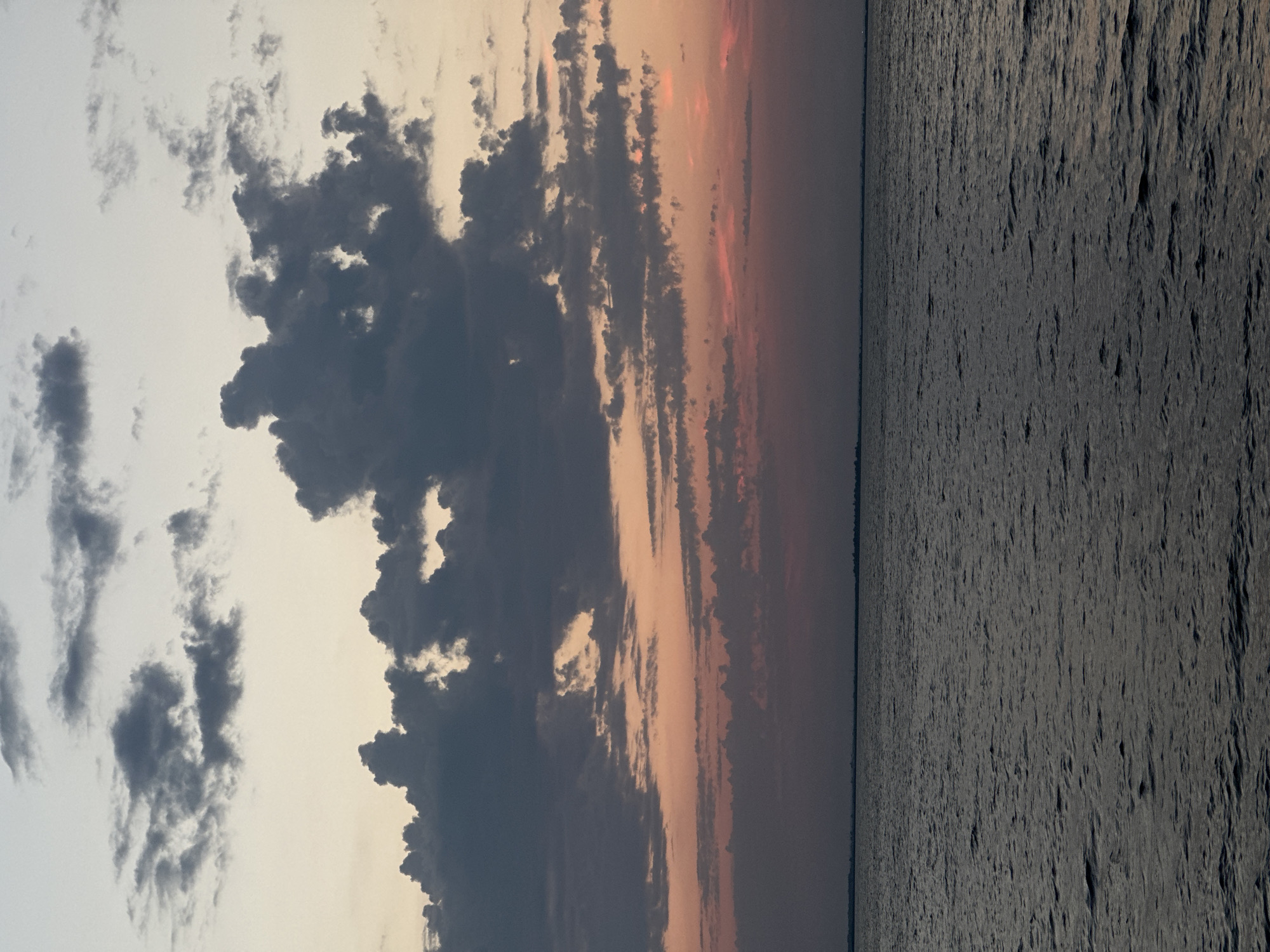 Sunset colors stretch across a calm Kazakhstan seascape