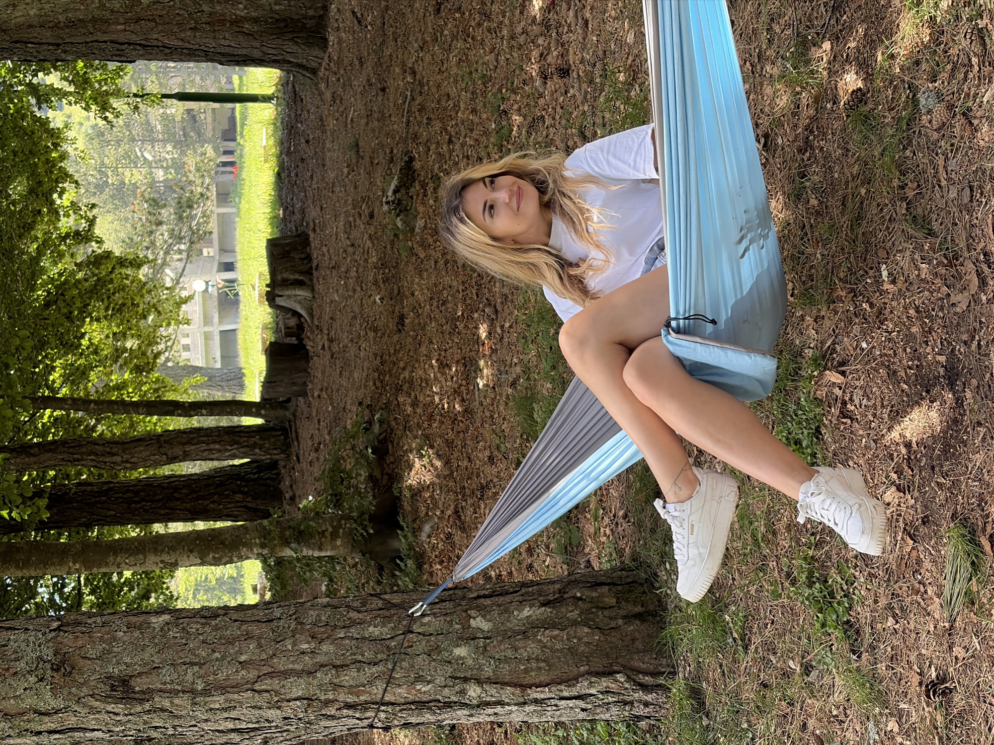 Woman enjoys peaceful hammock morning in Montenegro countryside