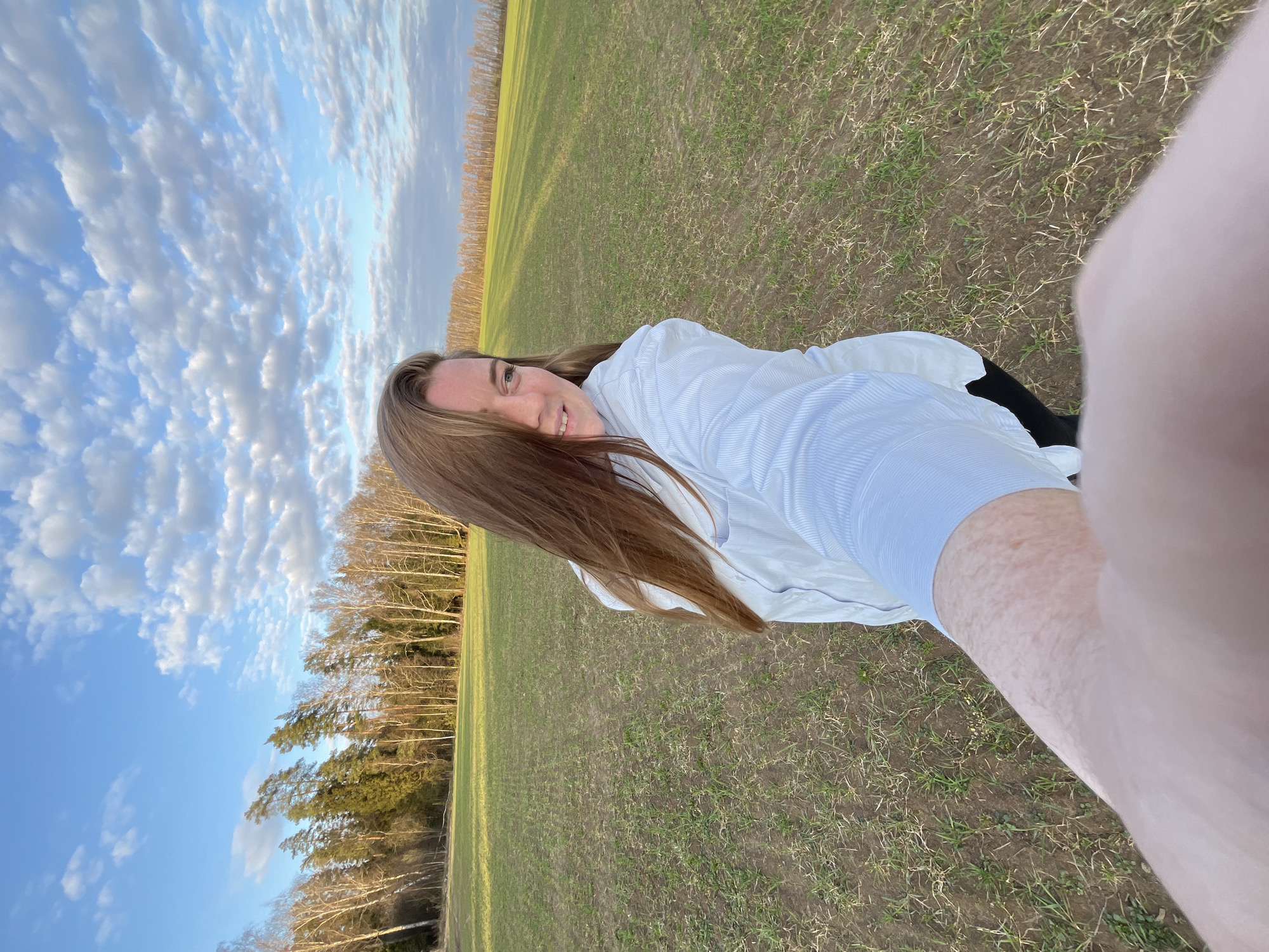 Woman documents rural field visit with selfies in Раздолье
