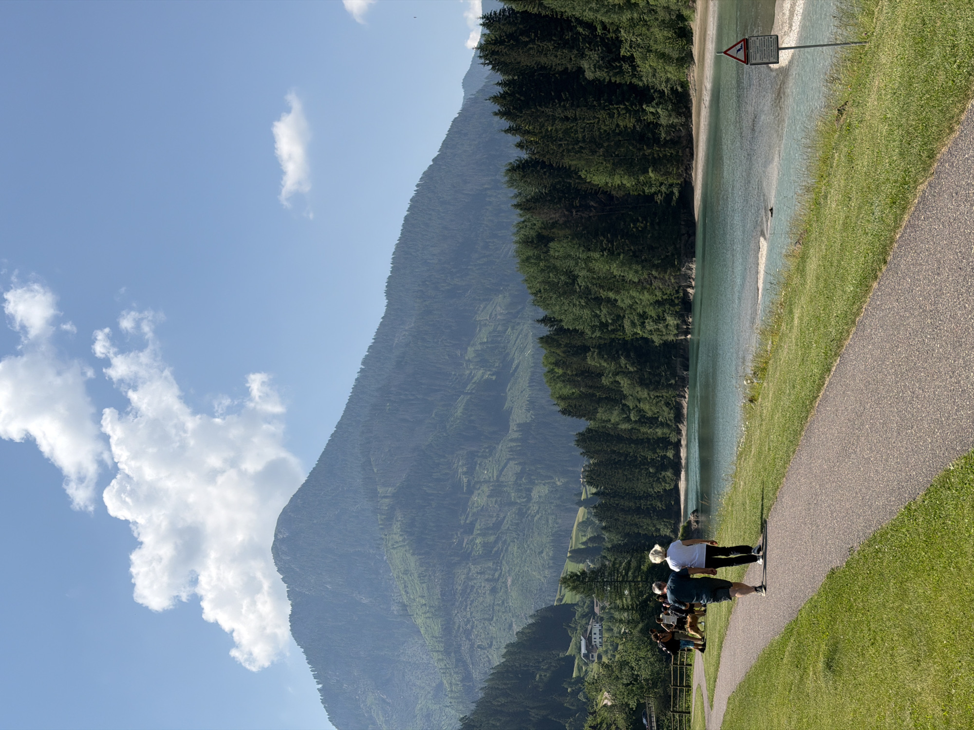Morning walk along a riverside path in Soraga di Fassa