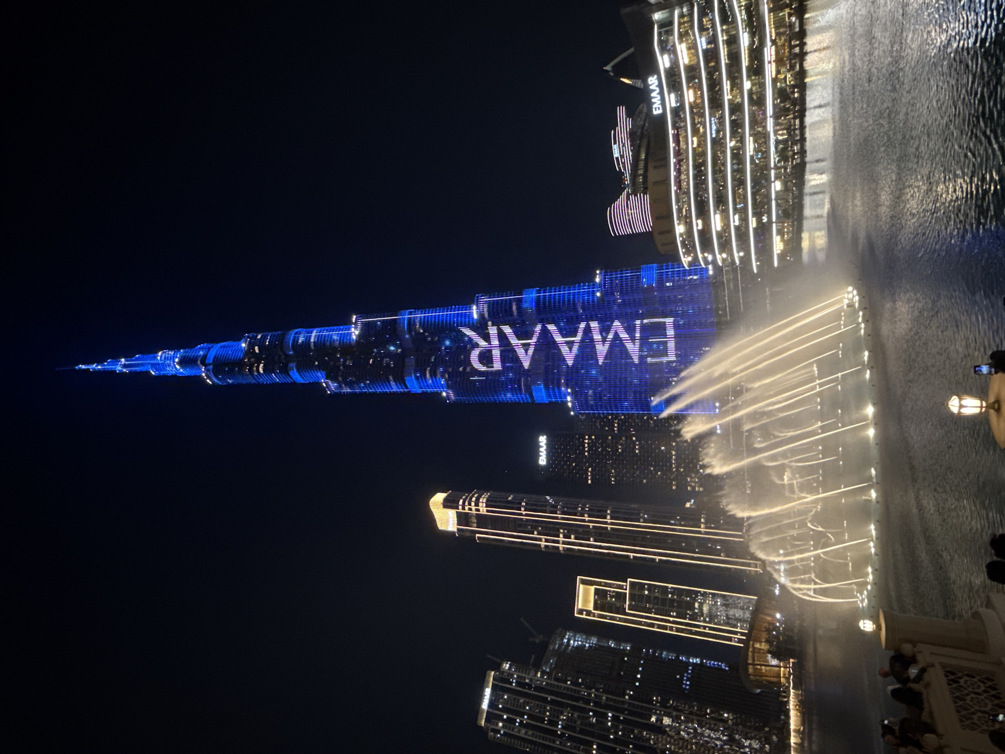 Burj Khalifa displays EMAAR lights during Dubai Fountain show