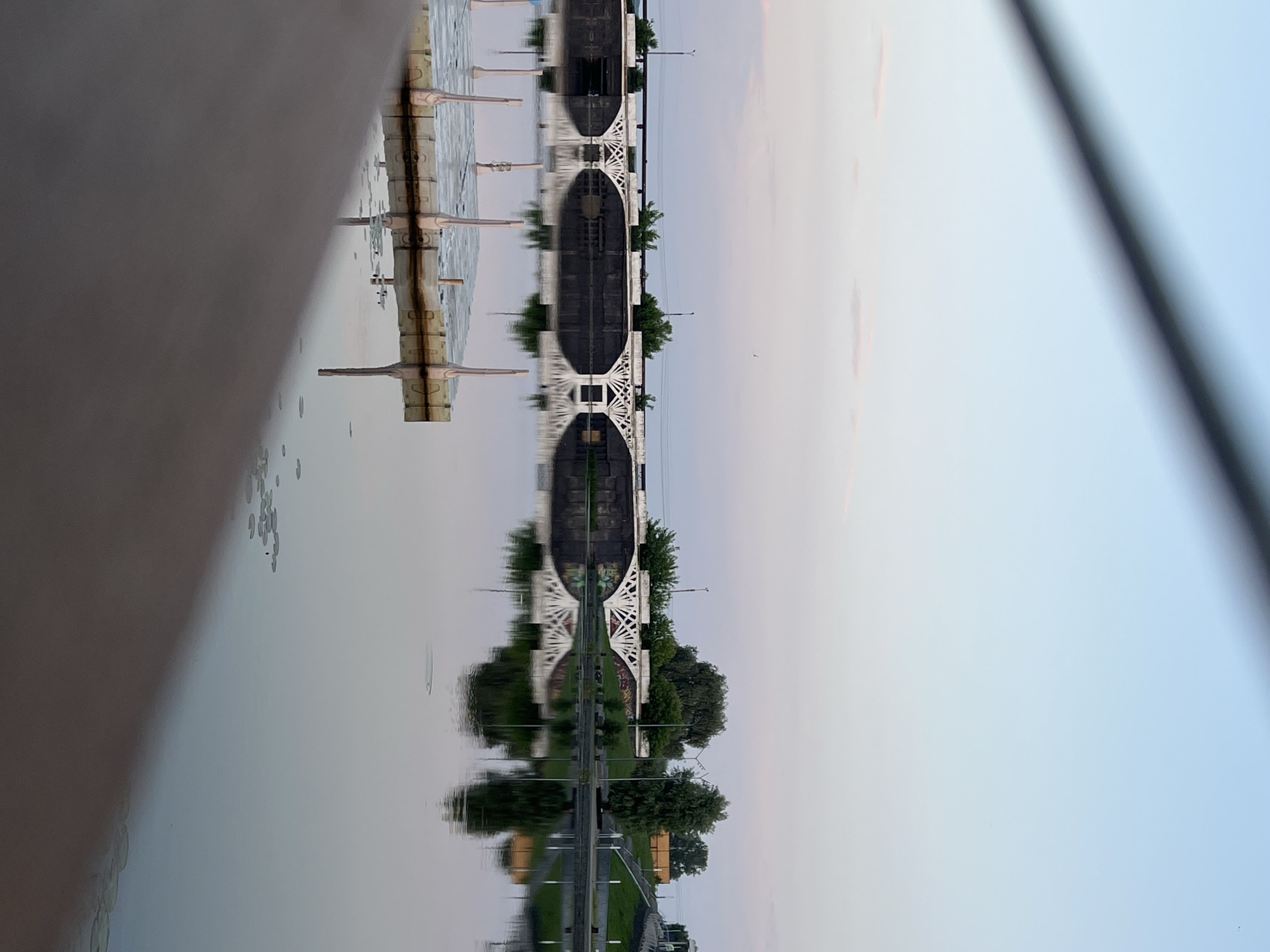 Evening waterfront walk along Votkinsk embankment captures sunset reflections