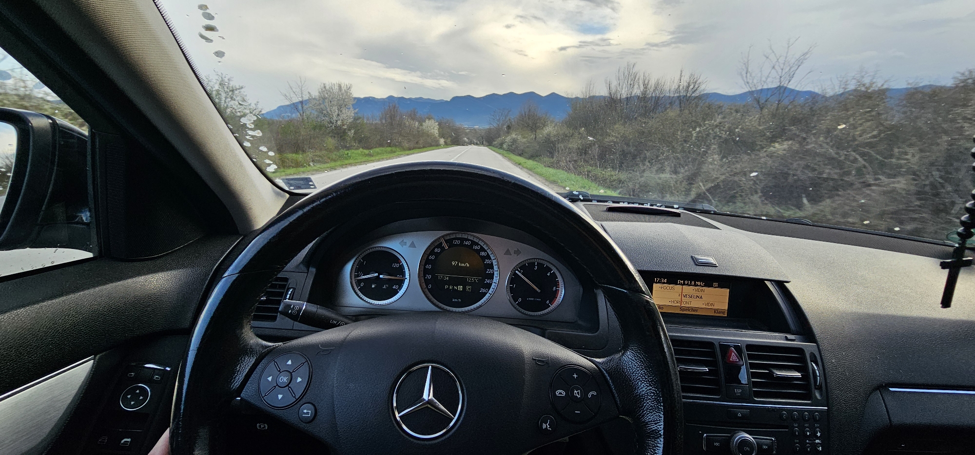 Driver captures mountain road view near Nefela, Bulgaria