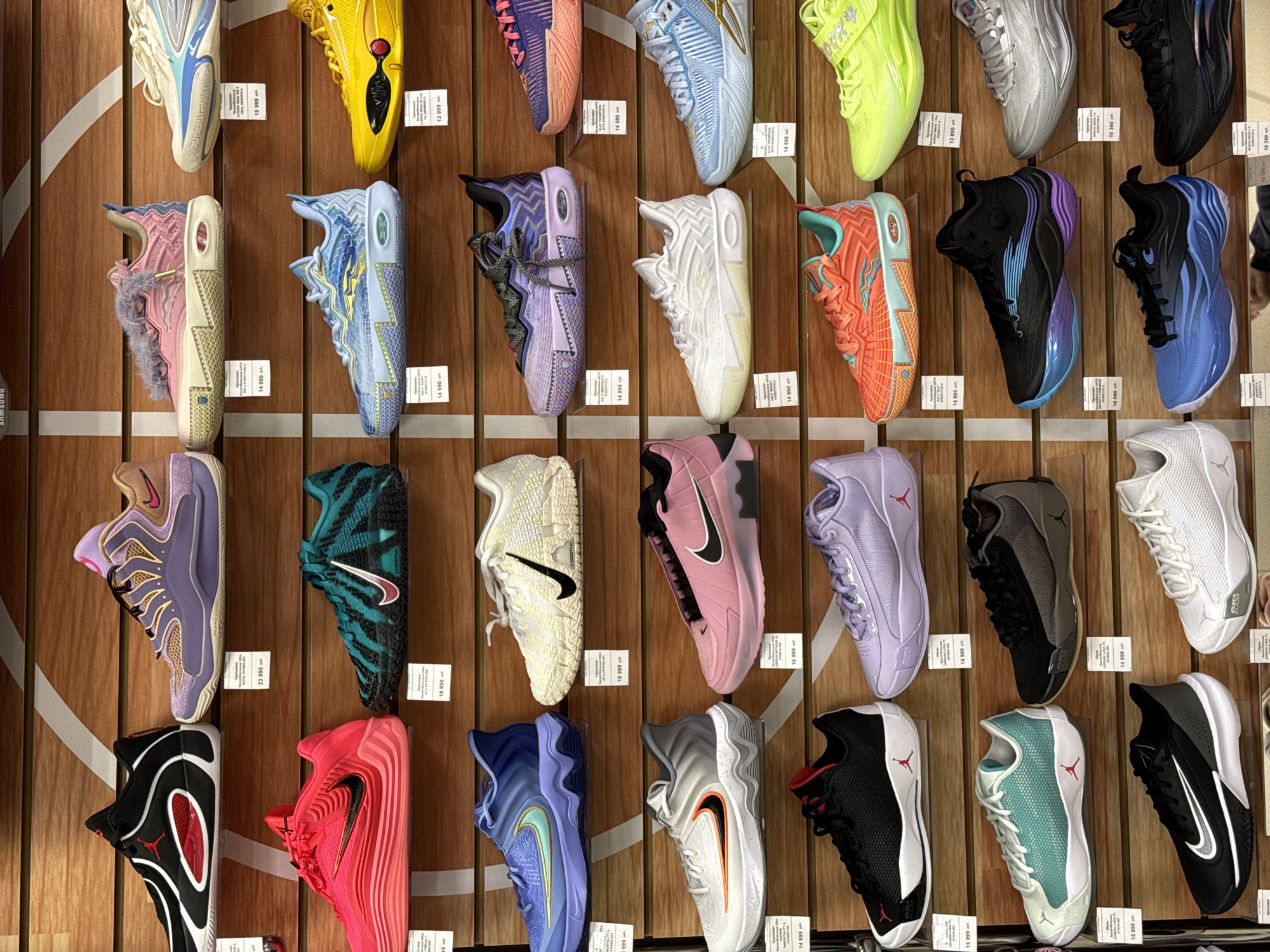 Customer shops sporting goods section in Krasnoyarsk store