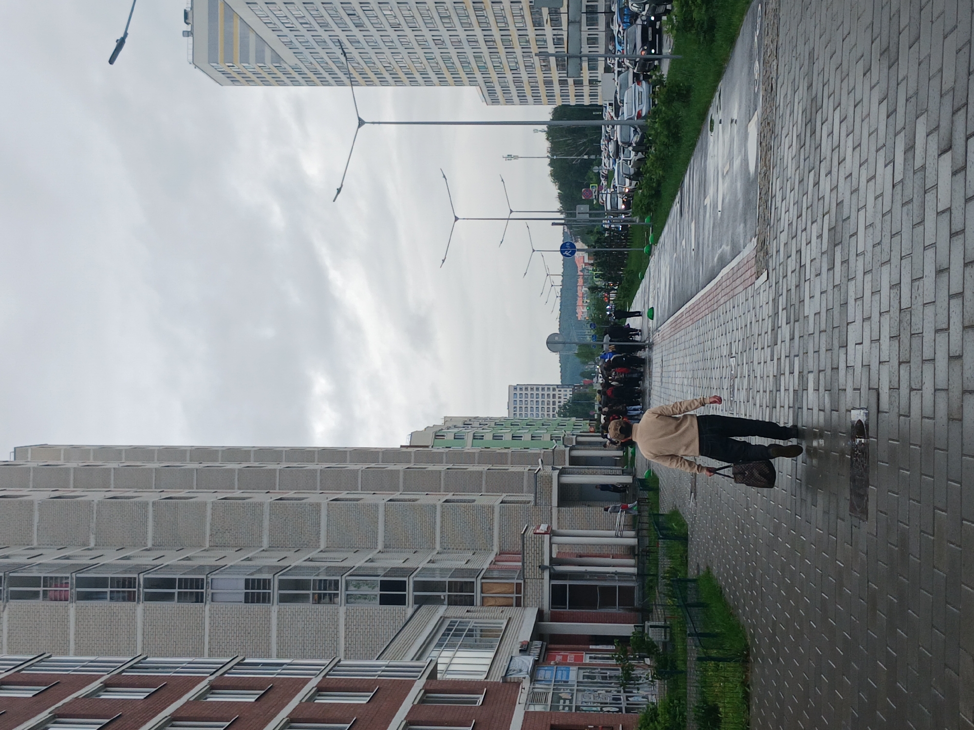 Rain-soaked morning street life documented across Yekaterinburg