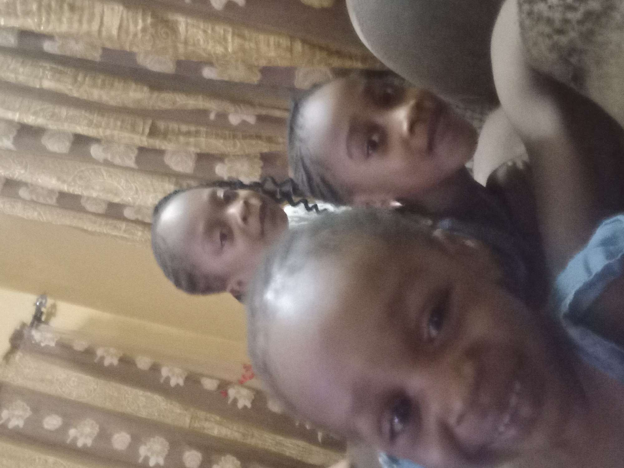 Family poses for photos at home in Nigeria