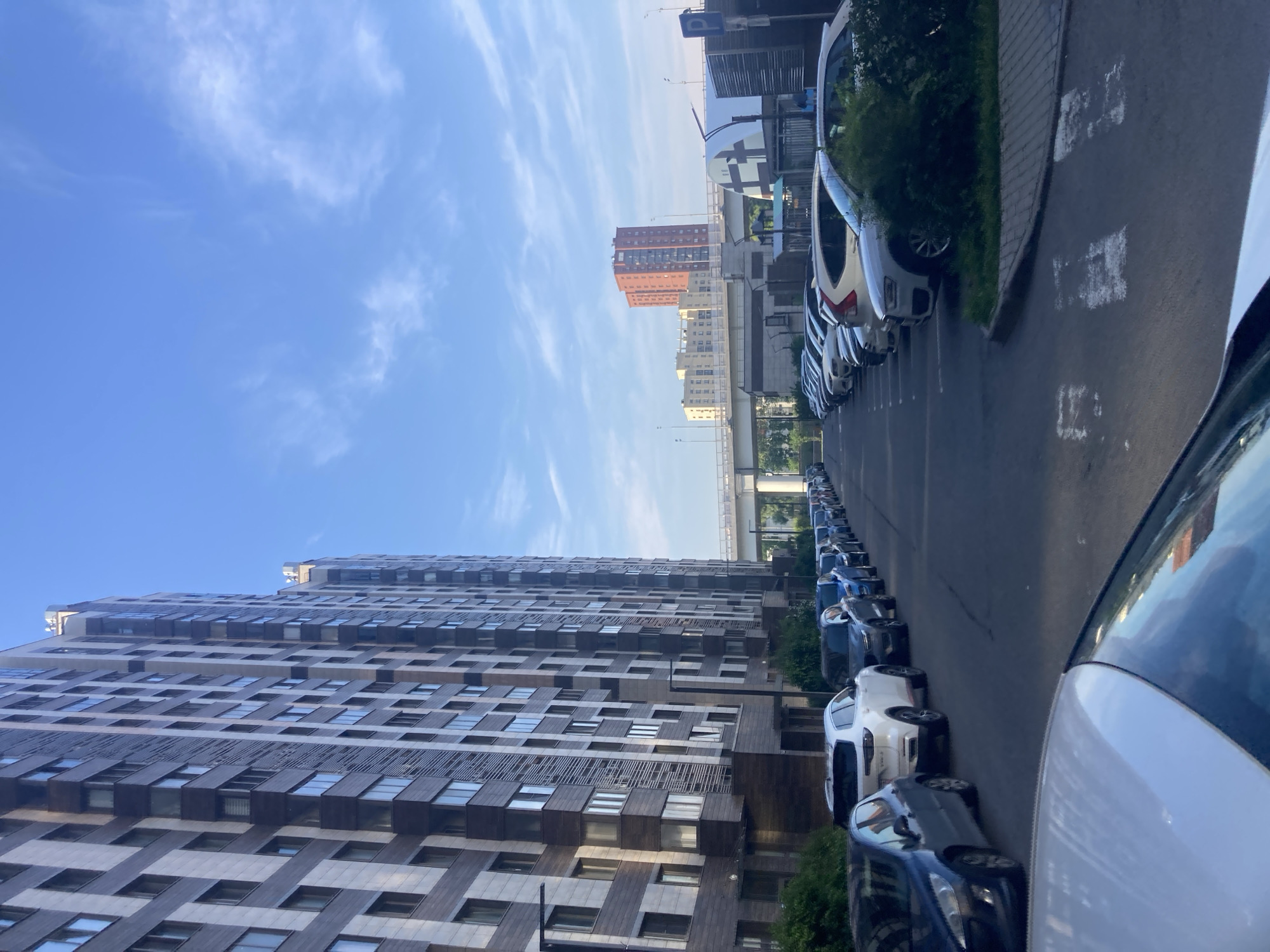 Moscow resident documents sunny daytime walk through city neighborhoods