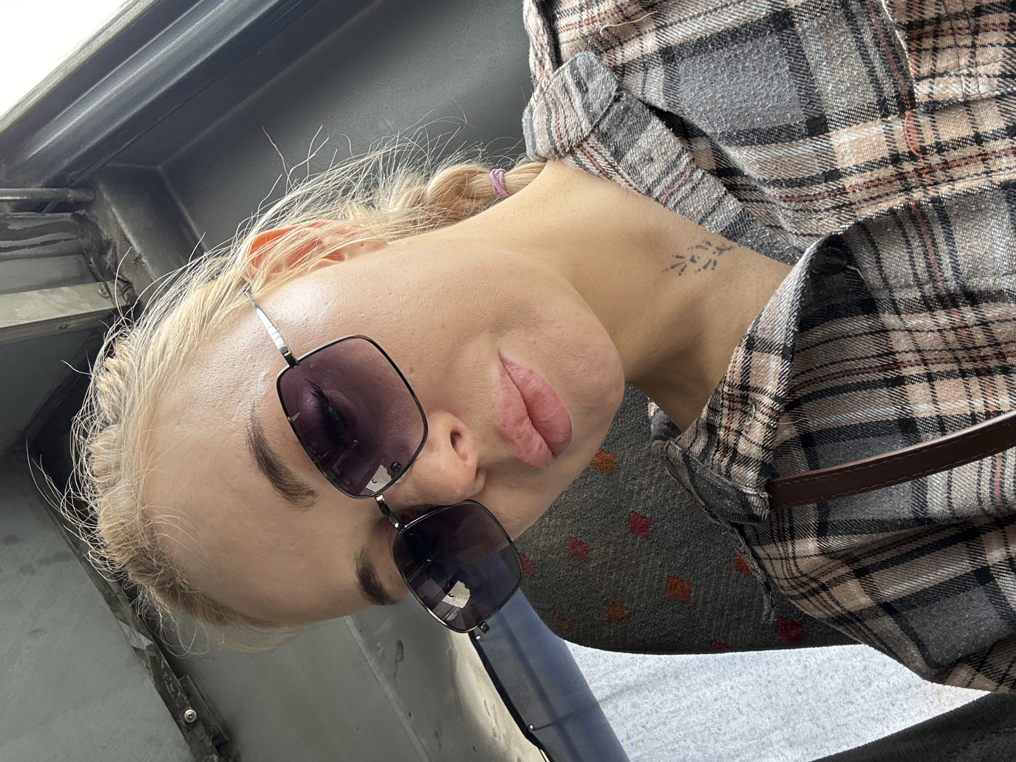 Woman travels with white dog through Megion, Russia