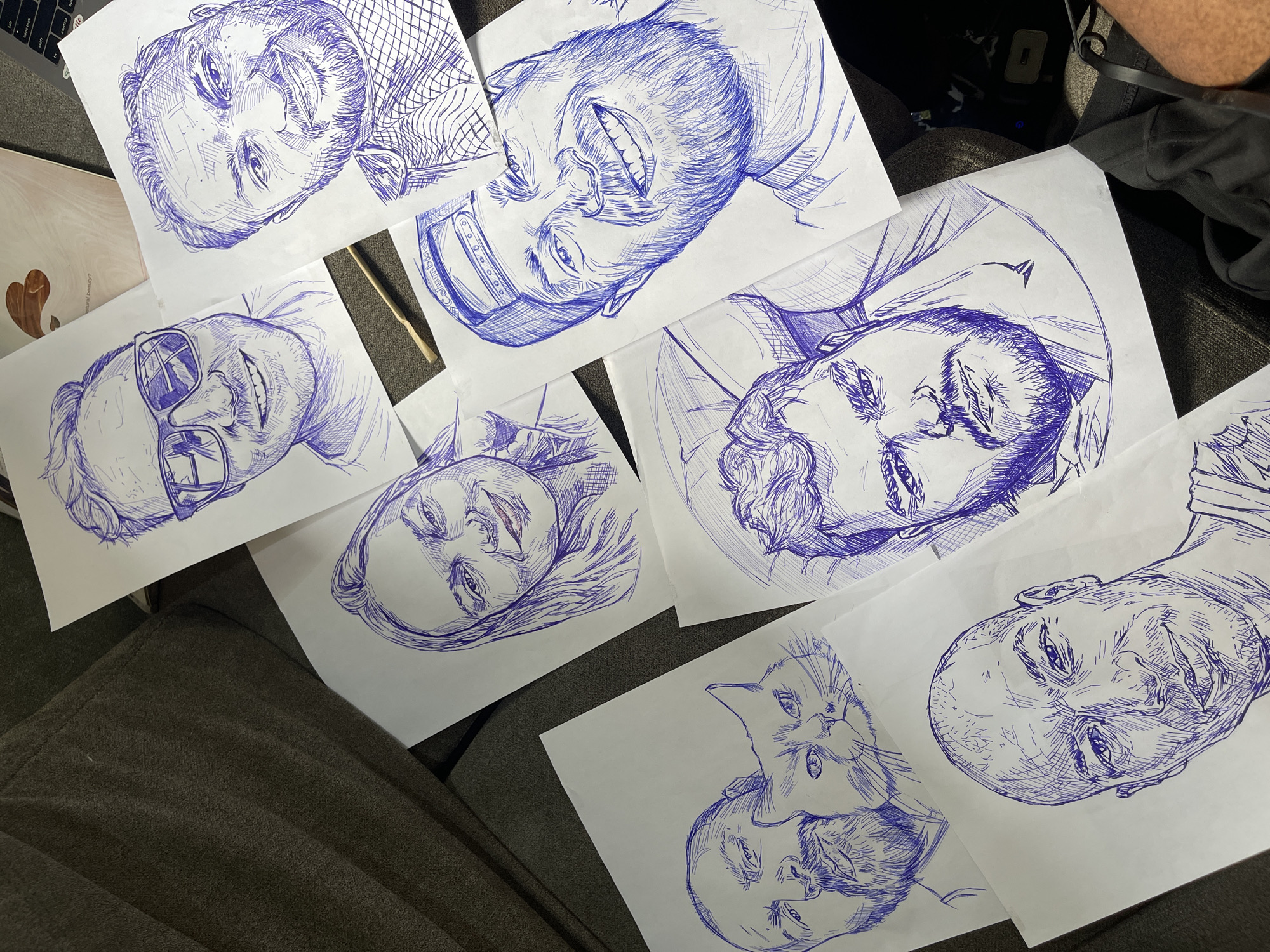 Pen-and-ink portrait sketches laid out in Abuja