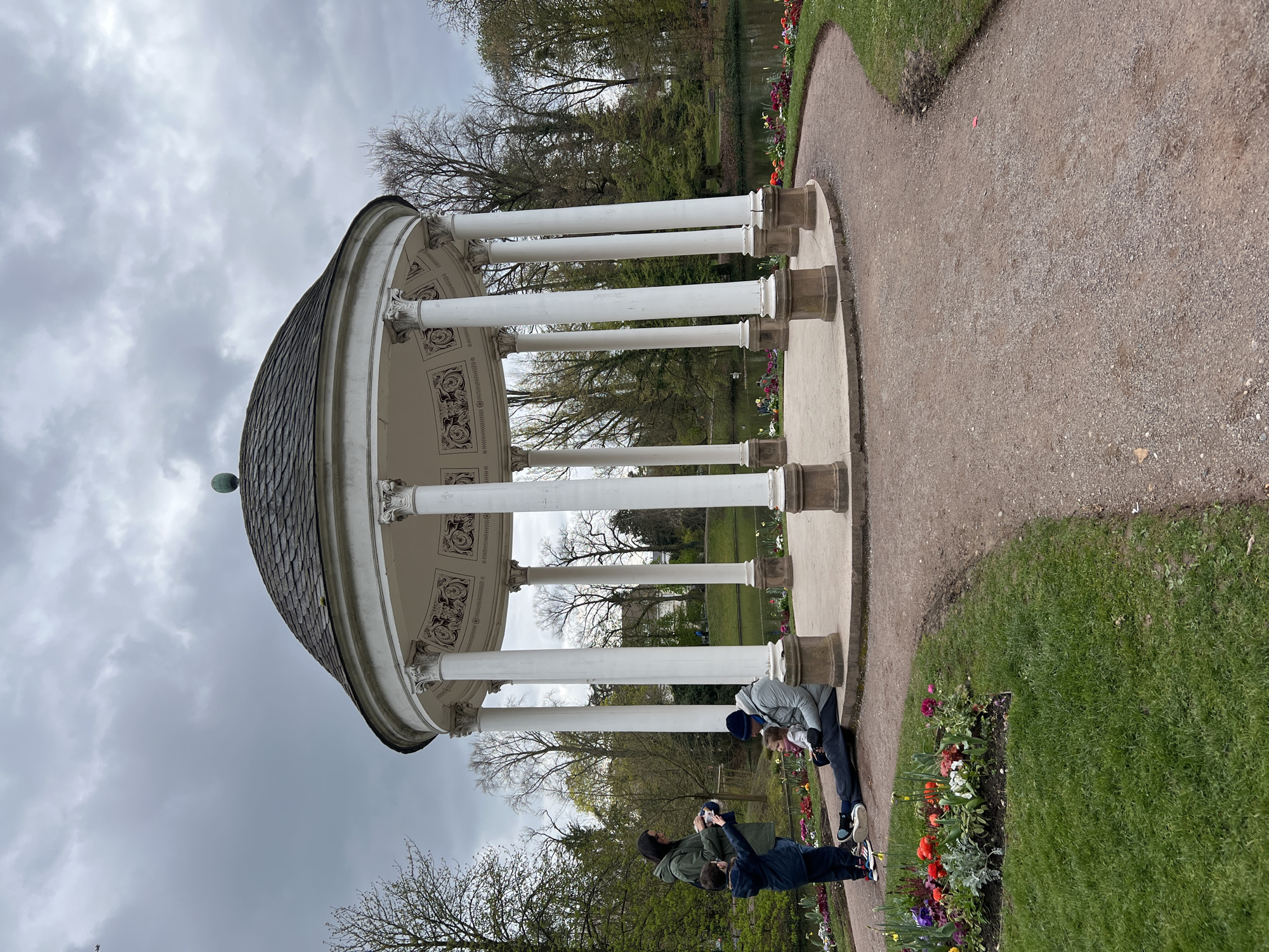 Park visitor takes selfies near gazebo in Strasbourg