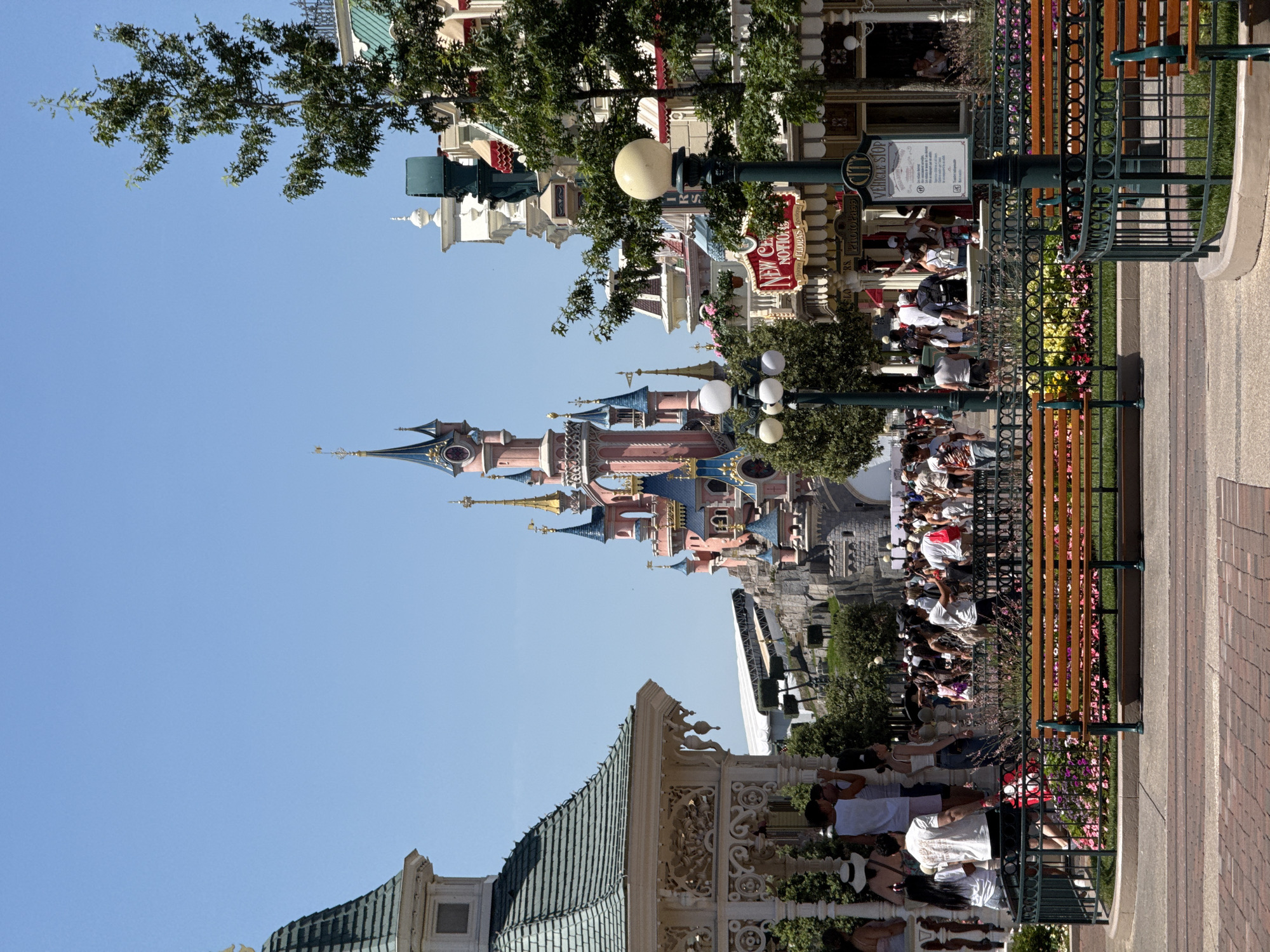 Disneyland Paris on a sunny afternoon, castle and gardens