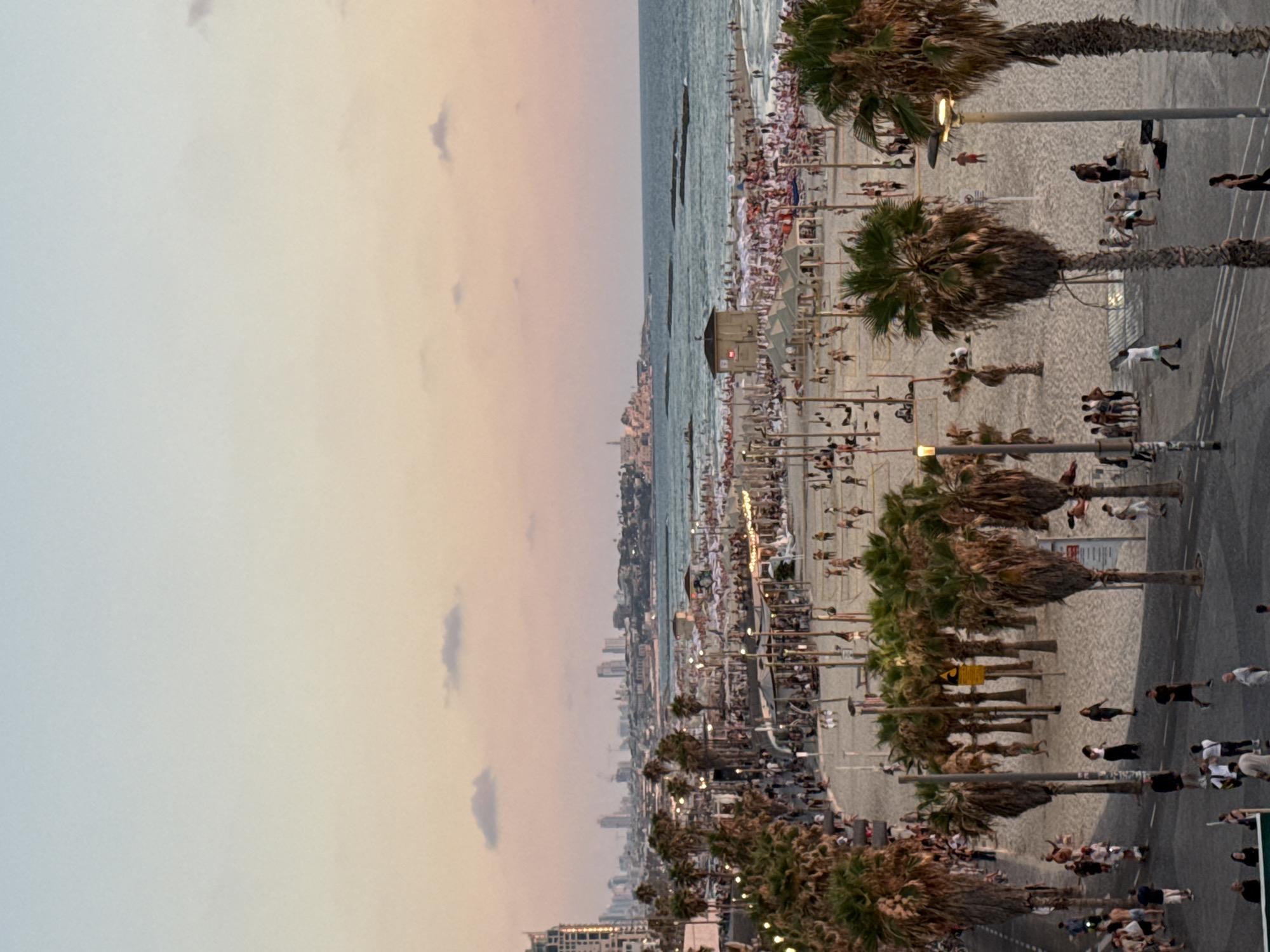 Tel Aviv waterfront at golden hour, beach to marina