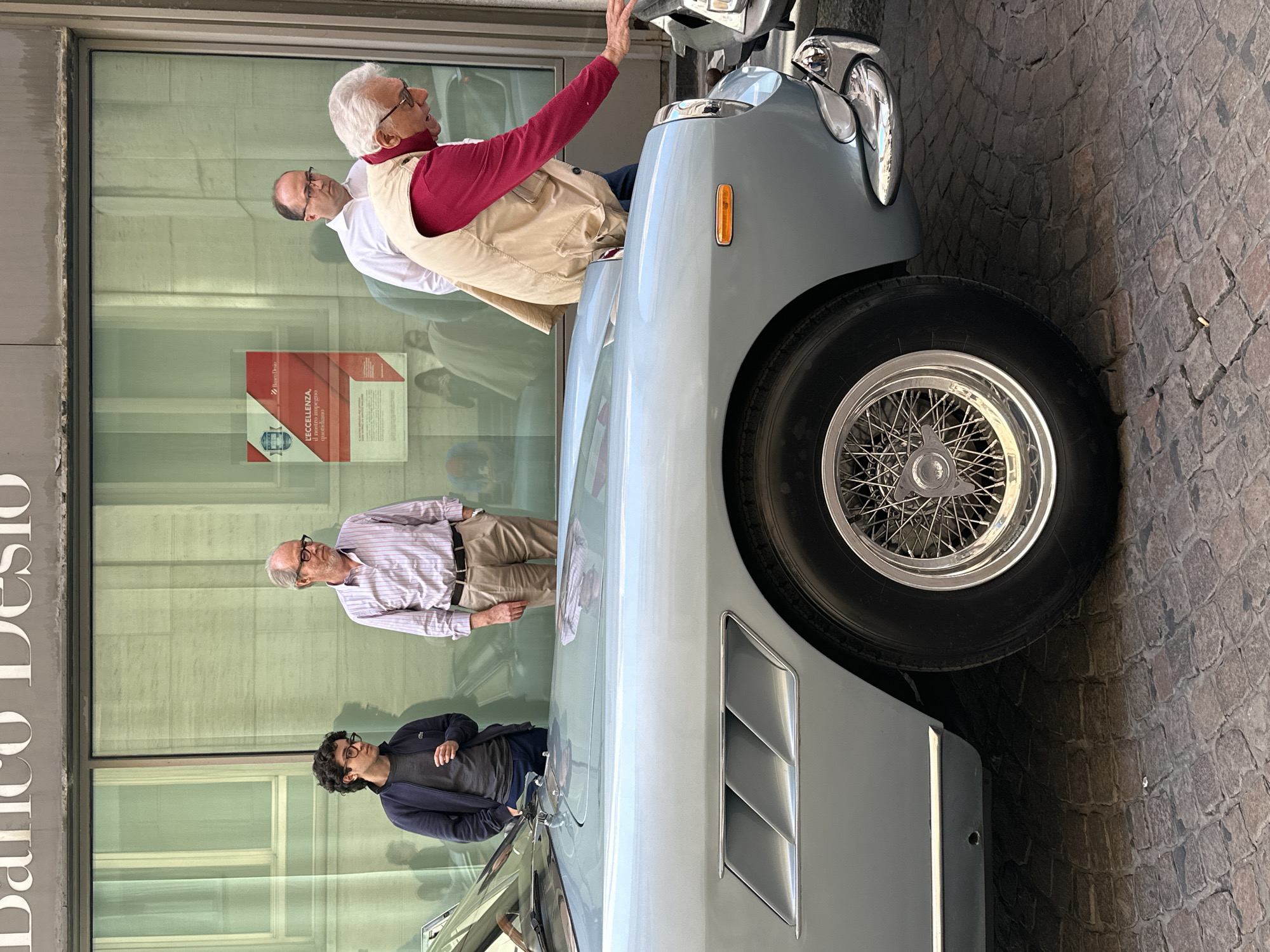Classic cars draw crowds on Milan street near bank