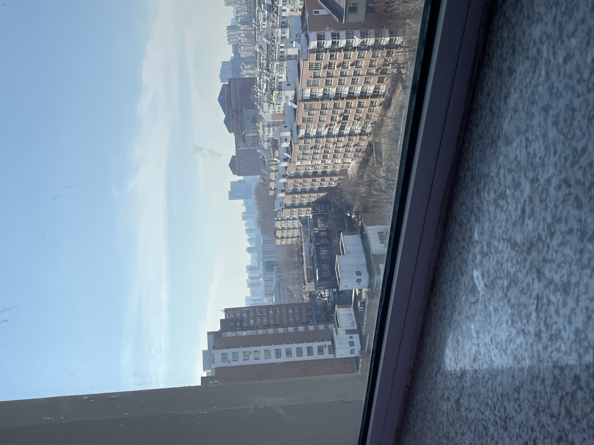 Morning window views capture Changchun's dense apartment landscape