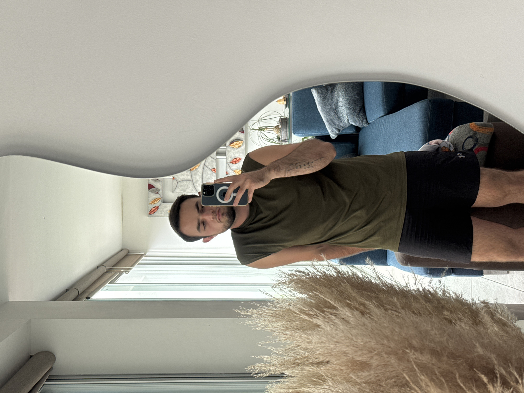 Man takes mirror selfie in Mexican home