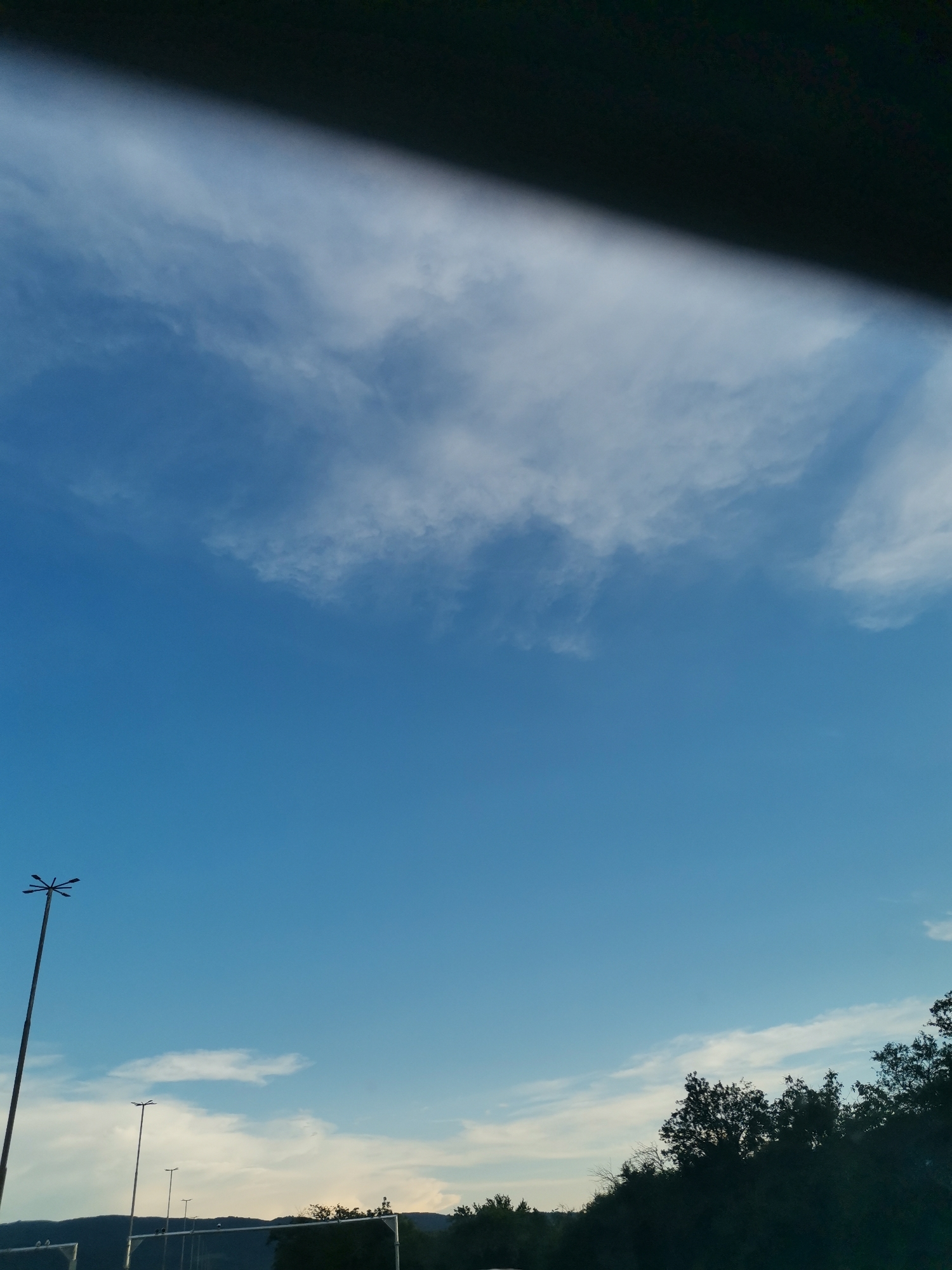 Daylight sky photographed from vehicle in Lozen, Bulgaria