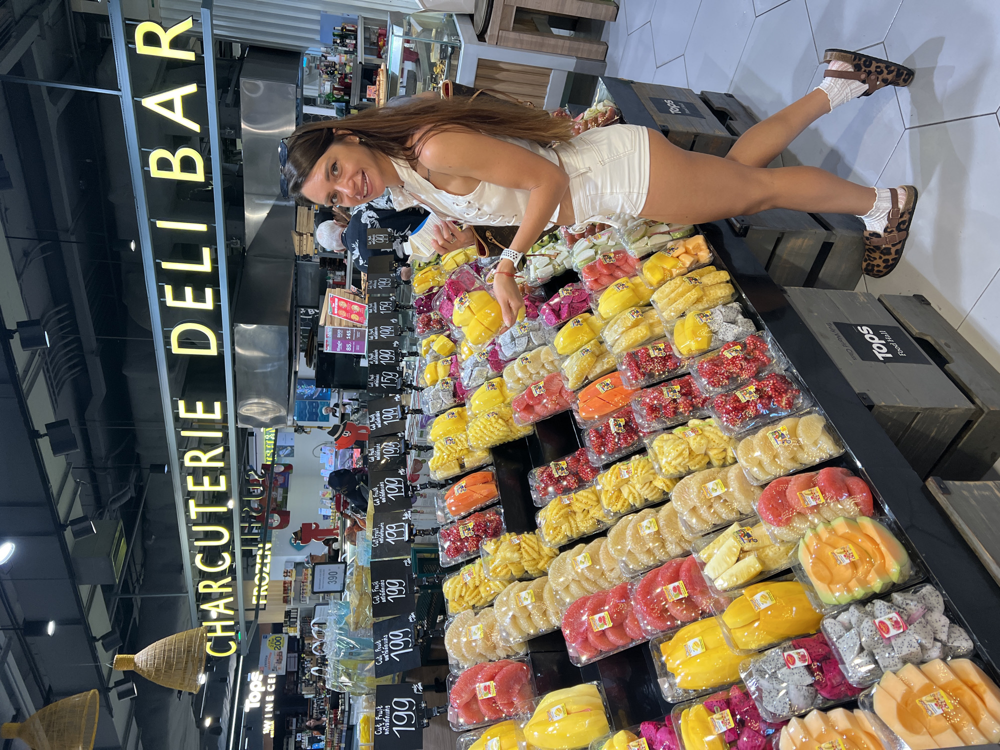 Supermarket browse in Ko Samui covers fruit, sushi, and spirits