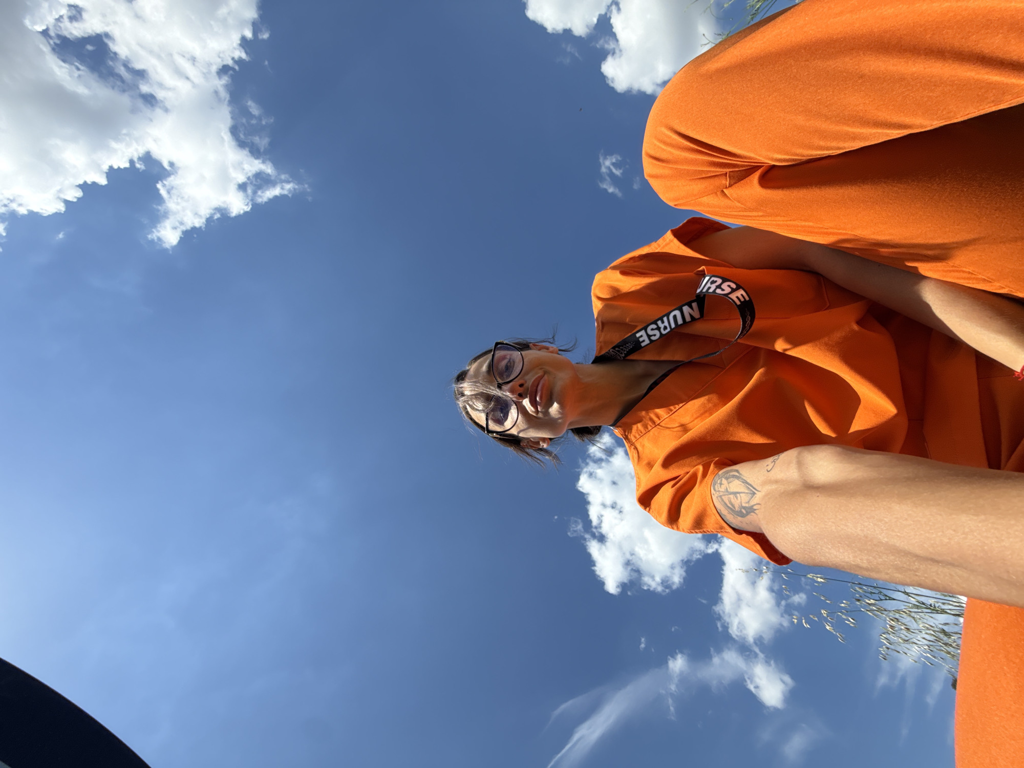 Nurse in orange scrubs takes casual photos around Pleven