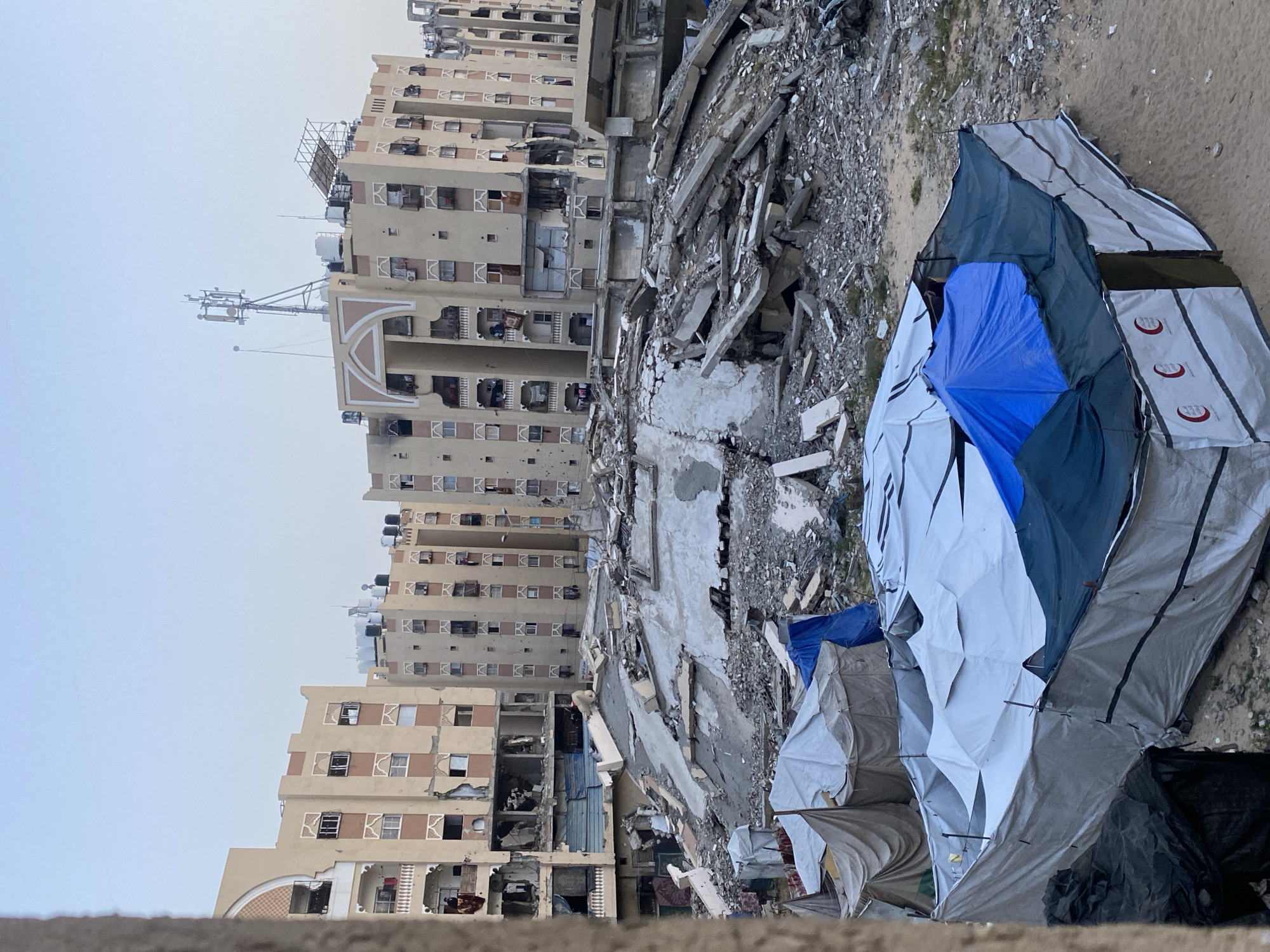 Khan Yunis families displaced, children play amid destruction