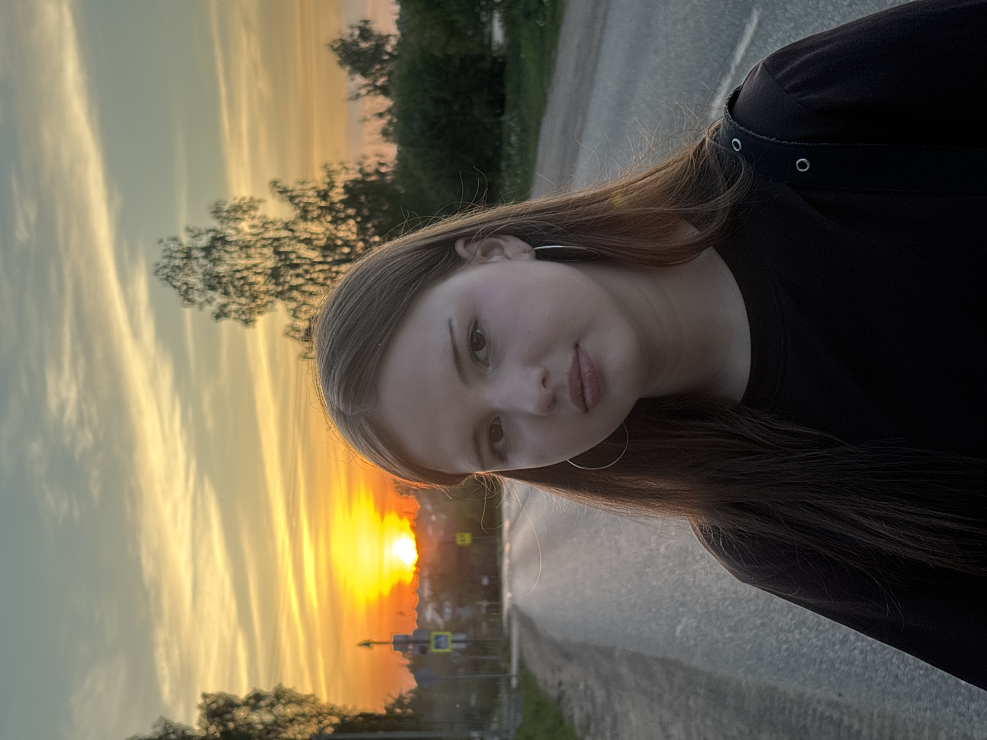 Woman poses for sunset photos in Фоки, Russia