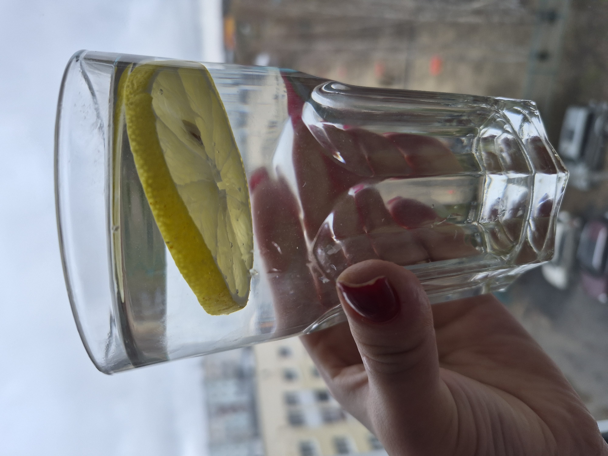 Woman takes selfie with drink in early morning Tobolsk