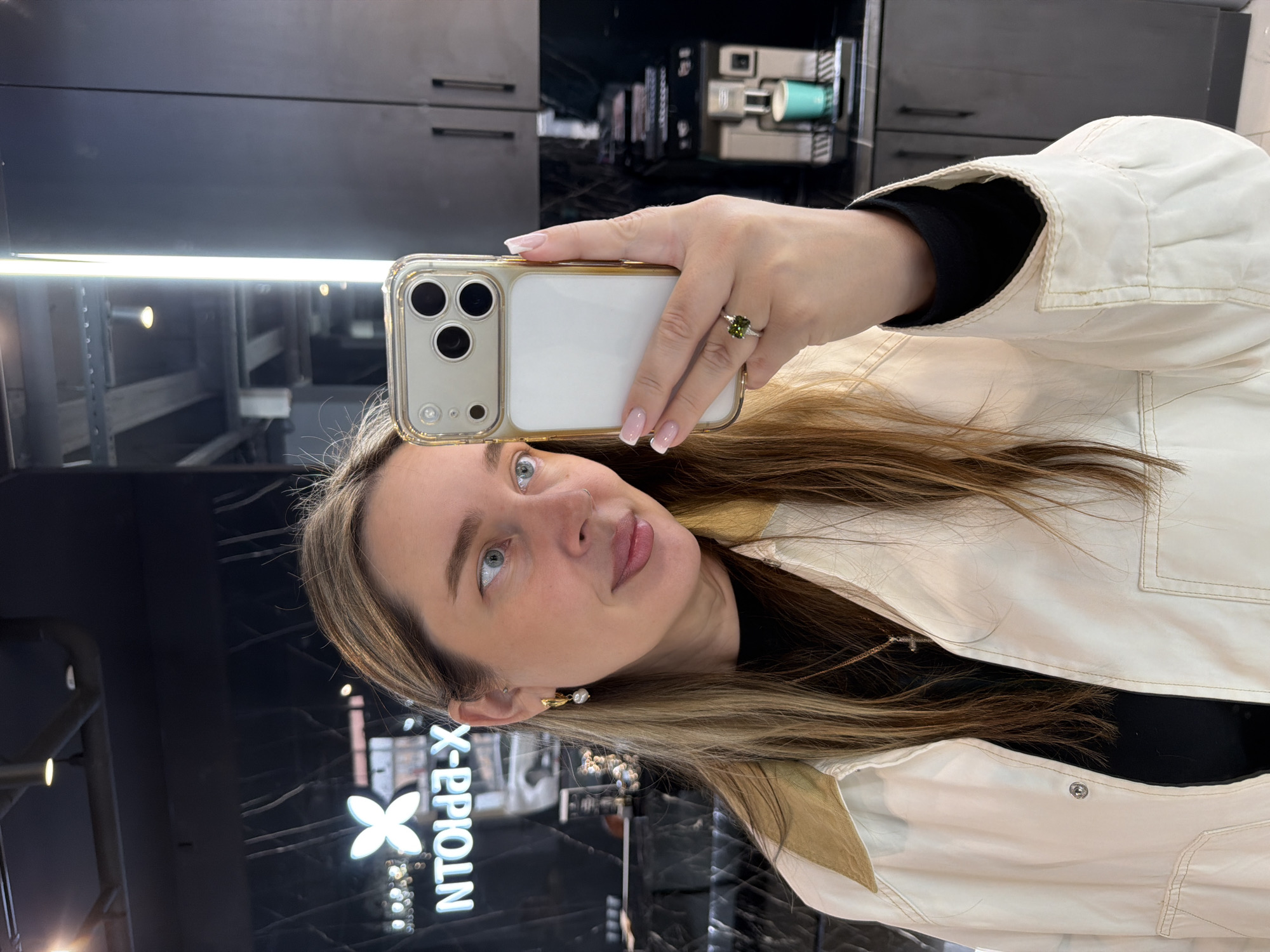 Woman takes multiple mirror selfies in upscale Moscow location