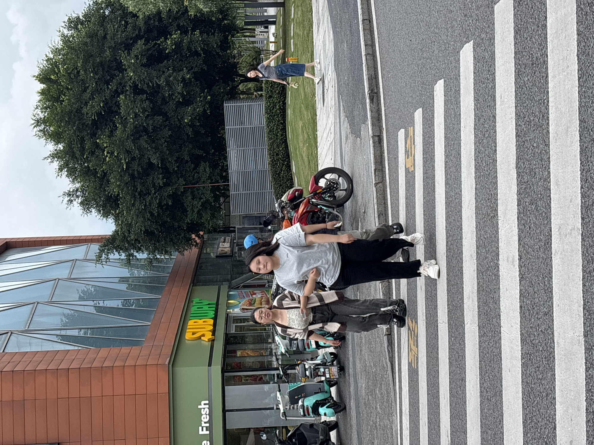 Everyday street life across Liangjiang's commercial district